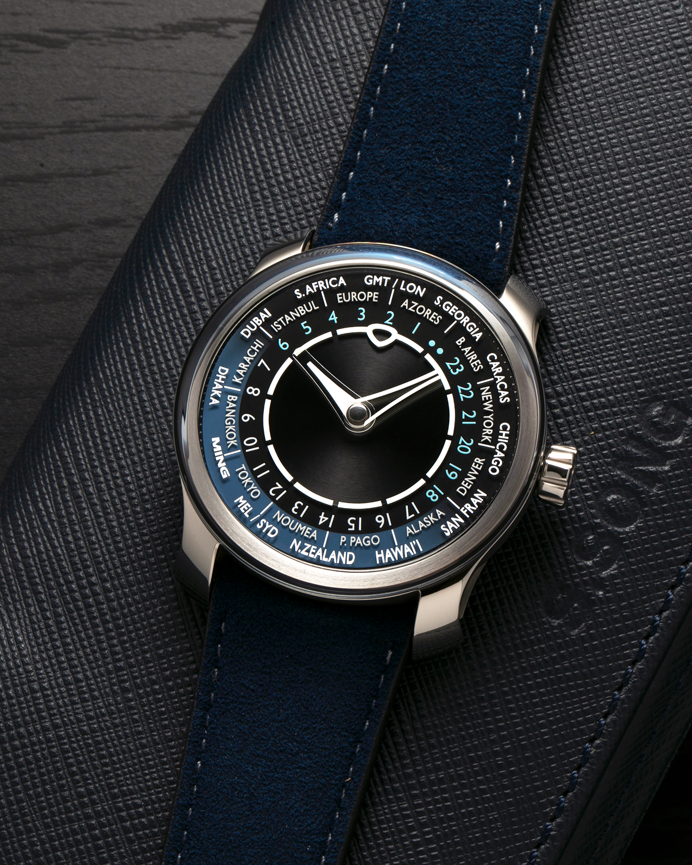 Brand: MING
Year: 2024 (Deliveries Began in March 2024)
Model: 29.01 World Timer, Limited Edition of 100 Pieces
Material: Grade 5 Titanium
Movement: Schwarz-Etienne for MING Cal. ASE 222, Manual-Winding Micro-Rotor
Case Dimensions: 40mm x 11.9mm (Lug-to-Lug 44.5mm)
Lug Width: 22mm
Strap: Jean Rousseau for MING Dark Navy Suede Leather Strap with Signed Titanium Keeperless Tang Buckle