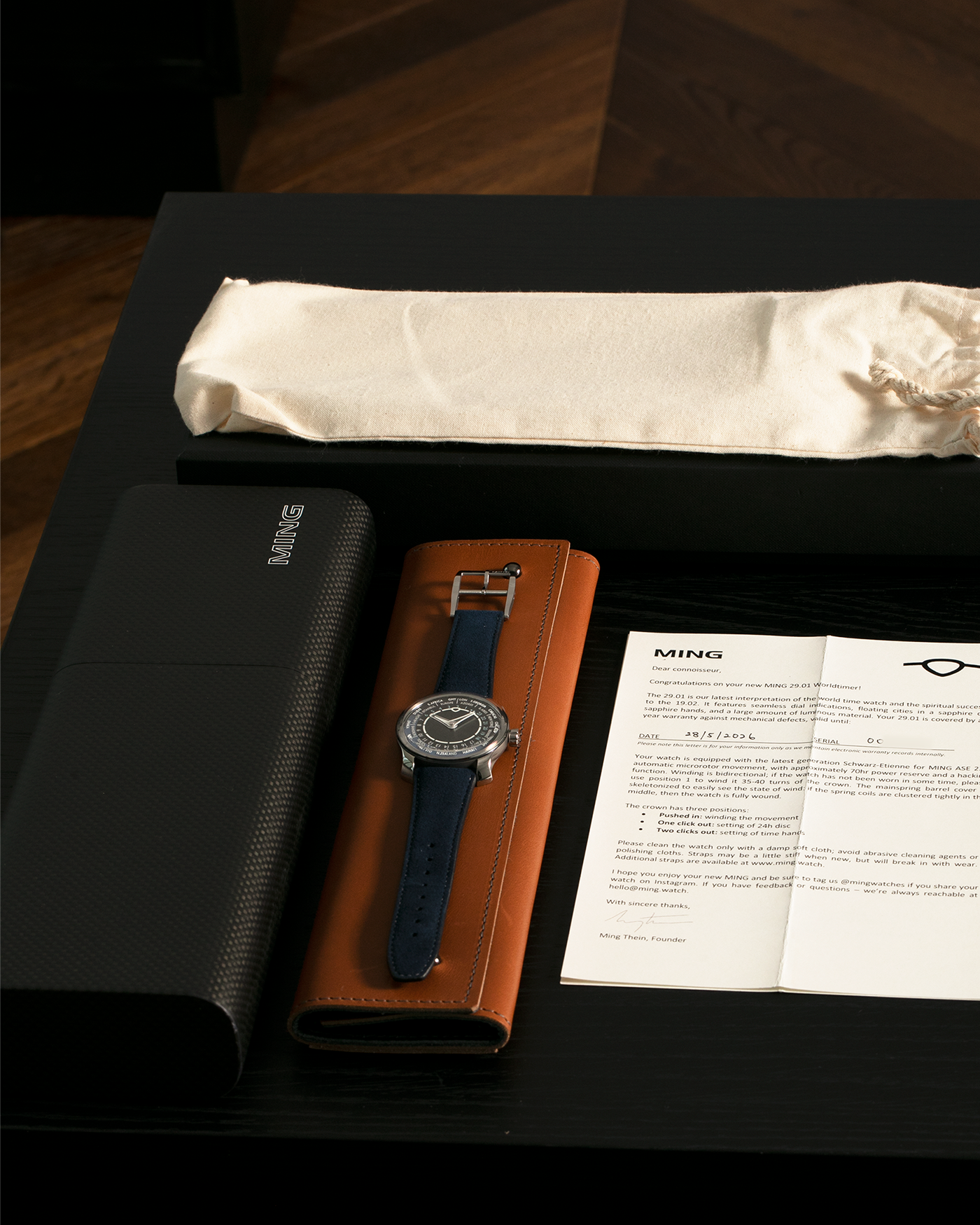 Brand: MING
Year: 2024 (Deliveries Began in March 2024)
Model: 29.01 World Timer, Limited Edition of 100 Pieces
Material: Grade 5 Titanium
Movement: Schwarz-Etienne for MING Cal. ASE 222, Manual-Winding Micro-Rotor
Case Dimensions: 40mm x 11.9mm (Lug-to-Lug 44.5mm)
Lug Width: 22mm
Strap: Jean Rousseau for MING Dark Navy Suede Leather Strap with Signed Titanium Keeperless Tang Buckle