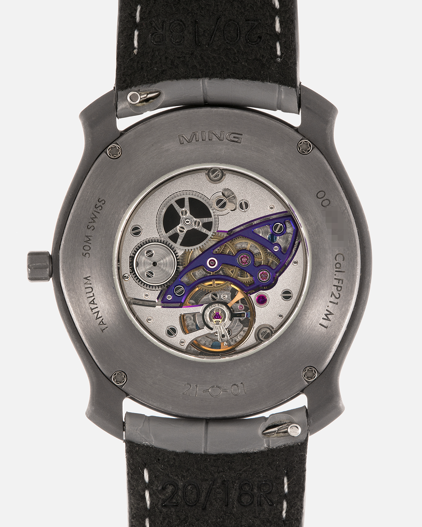 Brand: MING
Year: 2025
Model: Project 21 Souscription, Limited to 10 Pieces
Material: Tantalum Monobloc Case, FEMTOprint Borosilicate Crystal Dial, CVD-Coated Brass Dial Base
Movement: Heavily Modified Frederic Piguet Cal. 21, Manual-Winding
Case Dimensions: 35mm x 6.9mm (Lug-to-Lug 38.5mm)
Lug Width: 20mm
Strap: MING Dark Blue Alcantara Strap with Signed Tantalum Pin Buckle