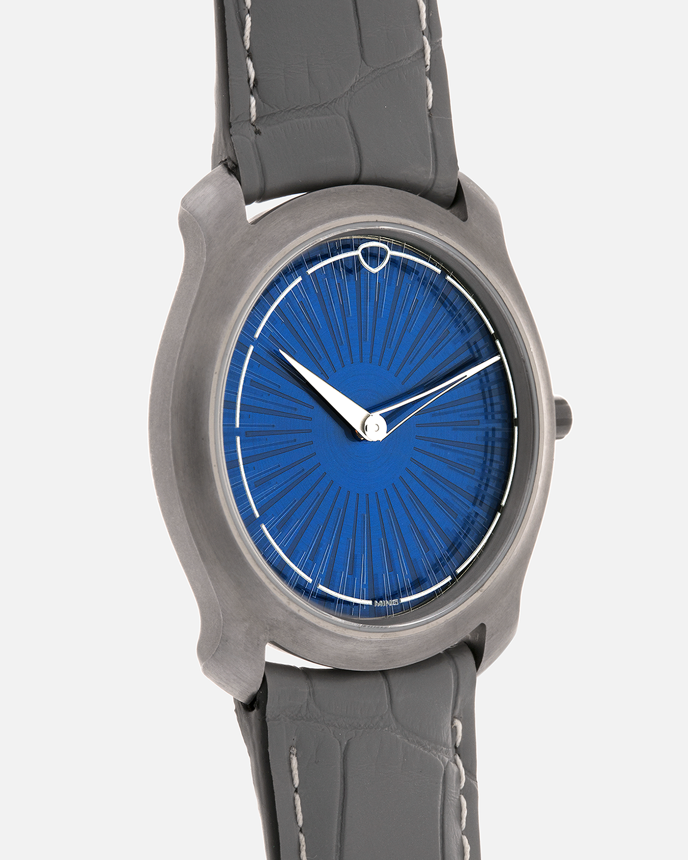 Brand: MING
Year: 2025
Model: Project 21 Souscription, Limited to 10 Pieces
Material: Tantalum Monobloc Case, FEMTOprint Borosilicate Crystal Dial, CVD-Coated Brass Dial Base
Movement: Heavily Modified Frederic Piguet Cal. 21, Manual-Winding
Case Dimensions: 35mm x 6.9mm (Lug-to-Lug 38.5mm)
Lug Width: 20mm
Strap: MING Dark Blue Alcantara Strap with Signed Tantalum Pin Buckle