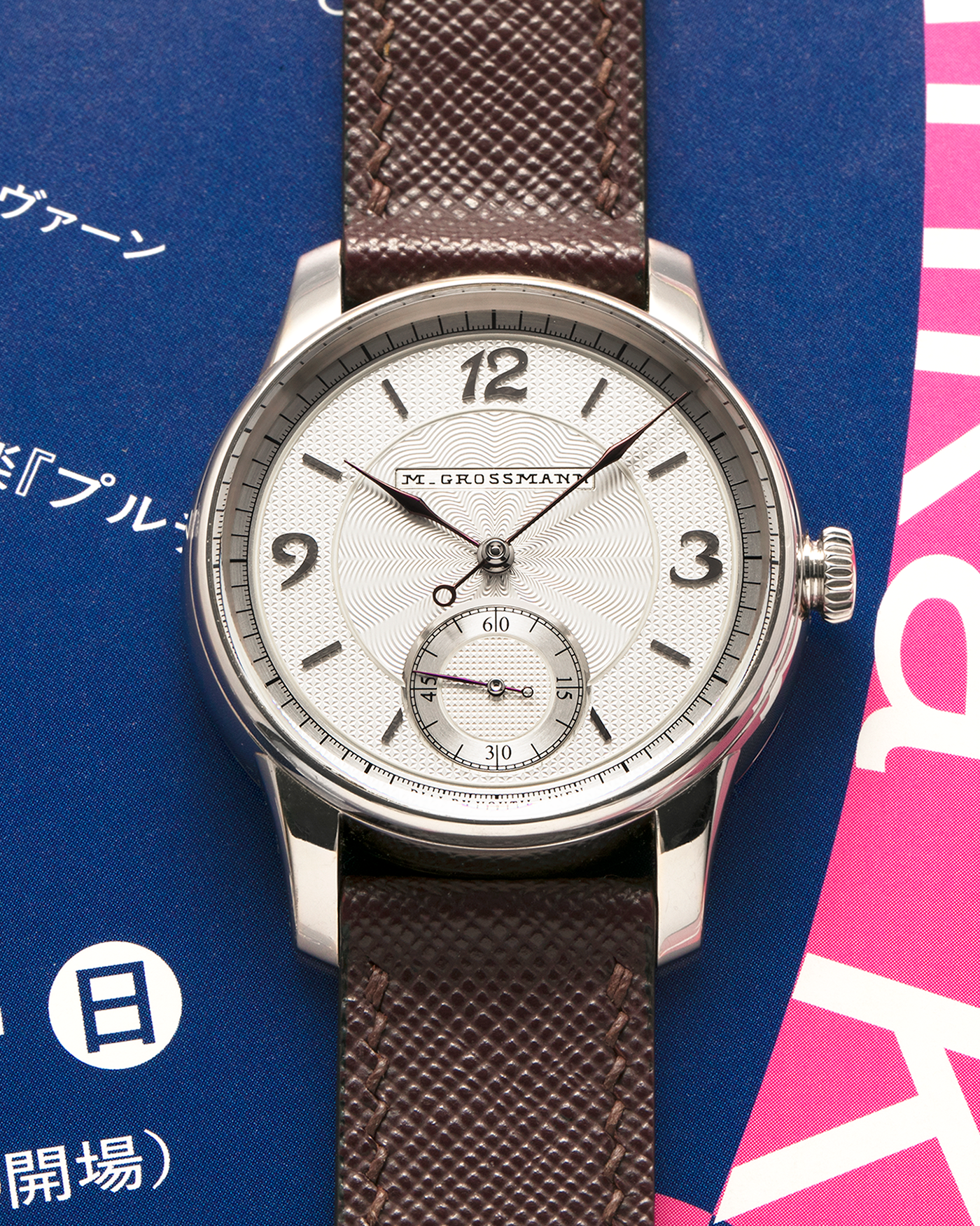 Brand: Moritz Grossmann
Year: 2023
Model: Benu 37 Grail Watch ‘Silver Bullet’
Reference Number: MG-003588
Material: 18k White Gold
Movement: Manual-Winding Cal. 102.1
Case Dimensions: 37mm Diameter 9.4mm Thickness
Strap: Moritz Grossman Anemone Kudu Leather Strap, Delugs White Himalayan Alligator Strap, Strapology Purple Textured Calf Strap and 18k White Gold Moritz Grossmann Tang Buckle
