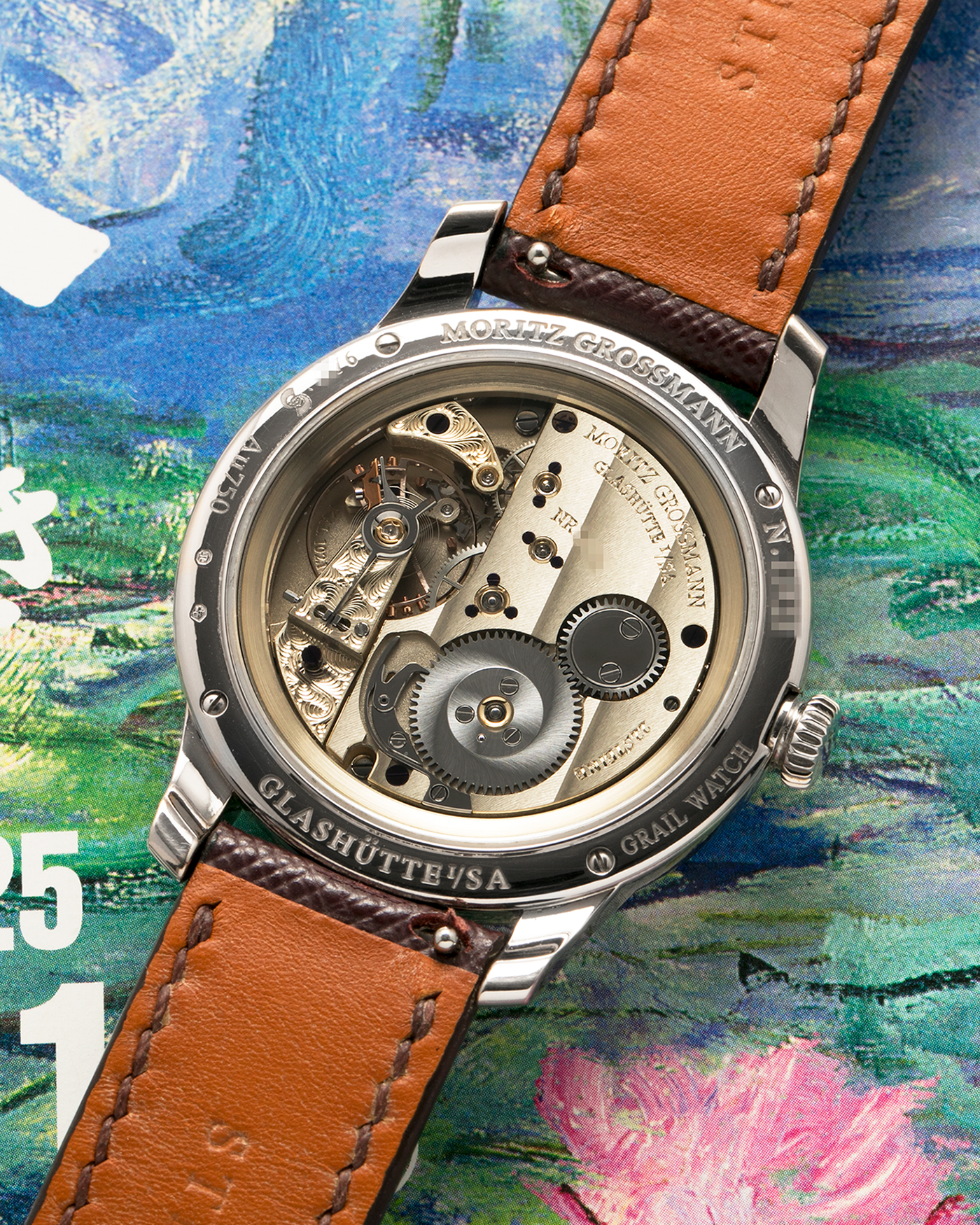 Brand: Moritz Grossmann
Year: 2023
Model: Benu 37 Grail Watch ‘Silver Bullet’
Reference Number: MG-003588
Material: 18k White Gold
Movement: Manual-Winding Cal. 102.1
Case Dimensions: 37mm Diameter 9.4mm Thickness
Strap: Moritz Grossman Anemone Kudu Leather Strap, Delugs White Himalayan Alligator Strap, Strapology Purple Textured Calf Strap and 18k White Gold Moritz Grossmann Tang Buckle