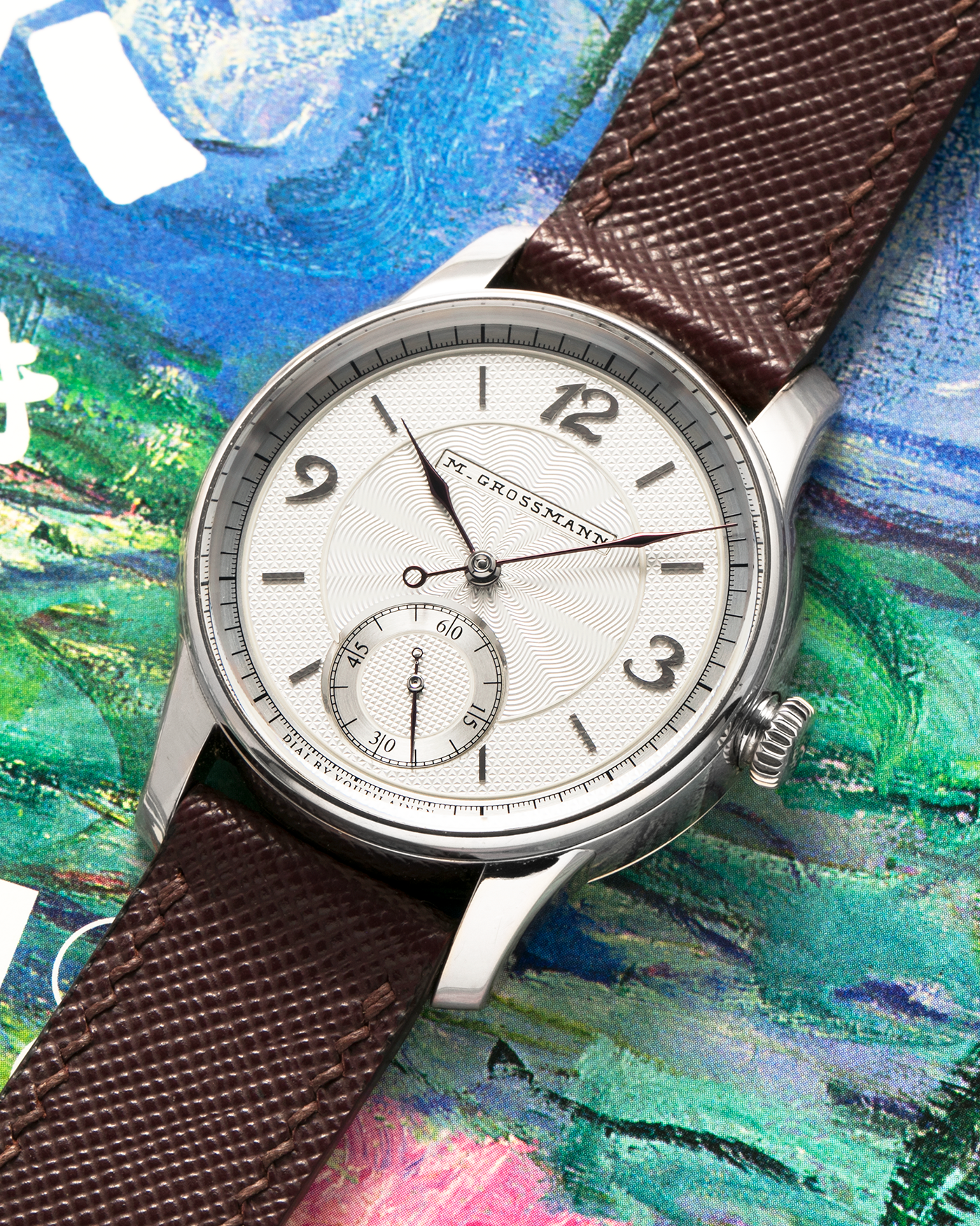 Brand: Moritz Grossmann
Year: 2023
Model: Benu 37 Grail Watch ‘Silver Bullet’
Reference Number: MG-003588
Material: 18k White Gold
Movement: Manual-Winding Cal. 102.1
Case Dimensions: 37mm Diameter 9.4mm Thickness
Strap: Moritz Grossman Anemone Kudu Leather Strap, Delugs White Himalayan Alligator Strap, Strapology Purple Textured Calf Strap and 18k White Gold Moritz Grossmann Tang Buckle