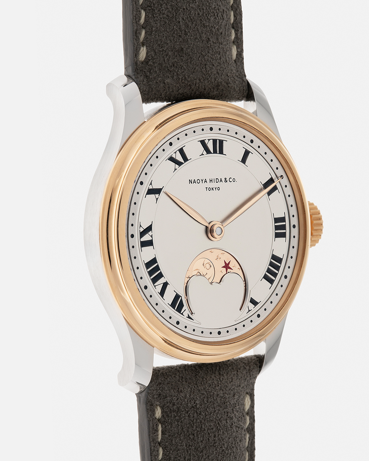 Brand: Naoya Hida
Year: 2025
Model: NH Type 3B-2, Revolution Magazine Limited Edition of 10 Pieces
Material: 904L Stainless Steel Case, German Silver Dial with Dark Grey DLC Treatment 
Movement: NH Cal. 3021LU (Based on Valjoux Cal. 7750), Manual-Winding
Case Dimensions: 37mm x 10.7mm (44mm Lug-to-Lug)
Lug Width: 20mm
Strap: Jean Rousseau Grey Suede Strap with Signed 904L Stainless Steel Tang Buckle