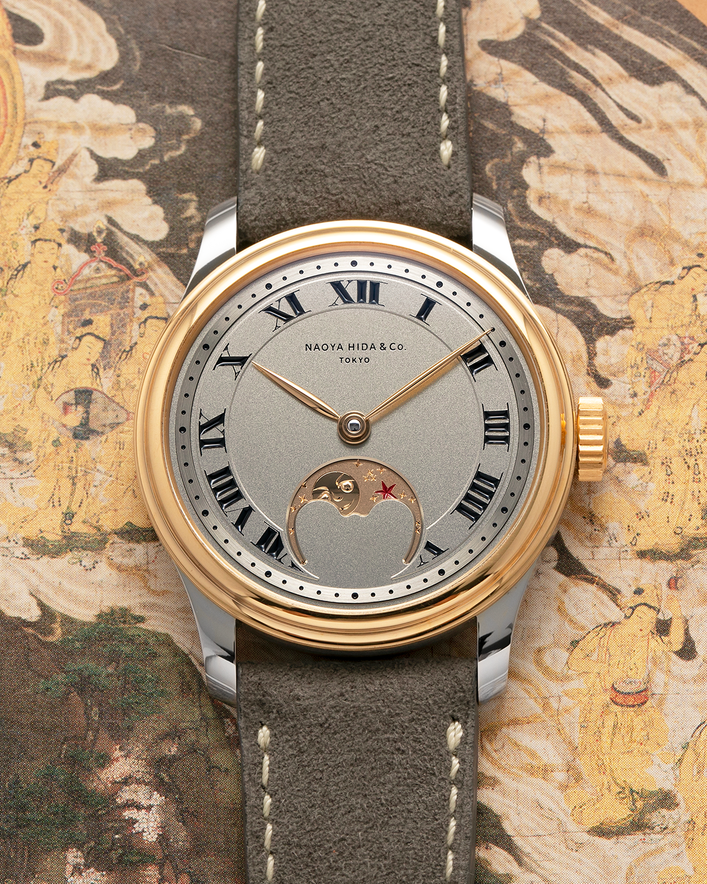 Brand: Naoya Hida
Year: 2025
Model: NH Type 3B-2, Revolution Magazine Limited Edition of 10 Pieces
Material: 904L Stainless Steel Case, German Silver Dial with Dark Grey DLC Treatment 
Movement: NH Cal. 3021LU (Based on Valjoux Cal. 7750), Manual-Winding
Case Dimensions: 37mm x 10.7mm (44mm Lug-to-Lug)
Lug Width: 20mm
Strap: Jean Rousseau Grey Suede Strap with Signed 904L Stainless Steel Tang Buckle