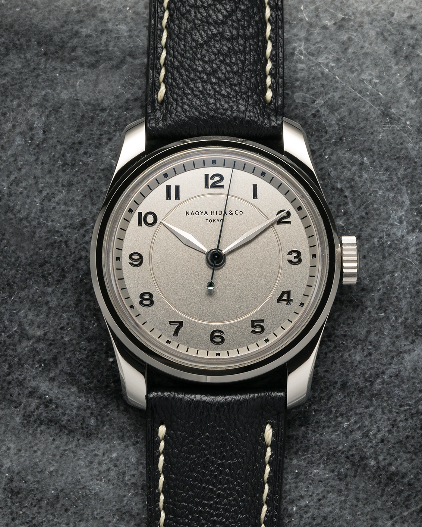 Brand: Naoya Hida
Year: 2024
Model: NH Type 4A
Material: 904L Stainless Steel Case, German Silver Dial
Movement: NH Cal. 3020SS (Based on Valjoux Cal. 7750), Manual-Winding
Case Dimensions: 36mm x 11mm (42mm Lug-to-Lug)
Lug Width: 20mm
Strap: Jean Rousseau Dark Brown Leather Strap with Signed 904L Stainless Steel Tang Buckle
