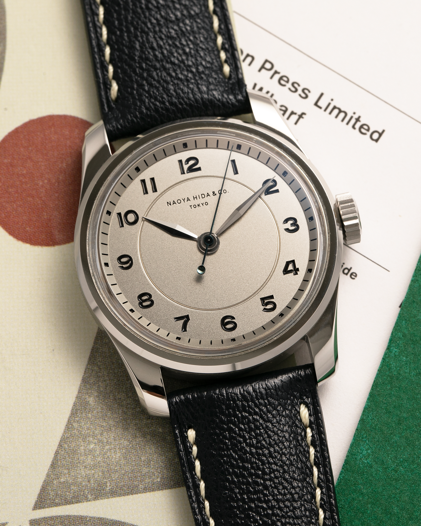 Brand: Naoya Hida
Year: 2024
Model: NH Type 4A
Material: 904L Stainless Steel Case, German Silver Dial
Movement: NH Cal. 3020SS (Based on Valjoux Cal. 7750), Manual-Winding
Case Dimensions: 36mm x 11mm (42mm Lug-to-Lug)
Lug Width: 20mm
Strap: Jean Rousseau Dark Brown Leather Strap with Signed 904L Stainless Steel Tang Buckle