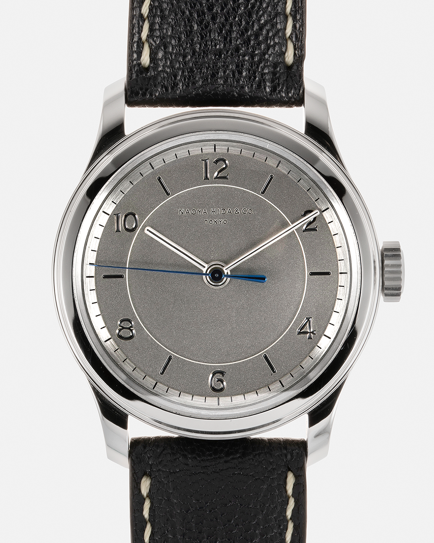 Brand: Naoya Hida Year: 2022 Model: NH Type 2B Material: 904L Stainless Steel Case, German Silver Dial  Movement: Cal. 3020CS, Manual-Winding Case Diameter: 37mm Strap: Naoya Hida (Jean Rousseau) Navy Blue Leather Strap with Contrasting Stitching and Signed Stainless Steel Tang Buckle