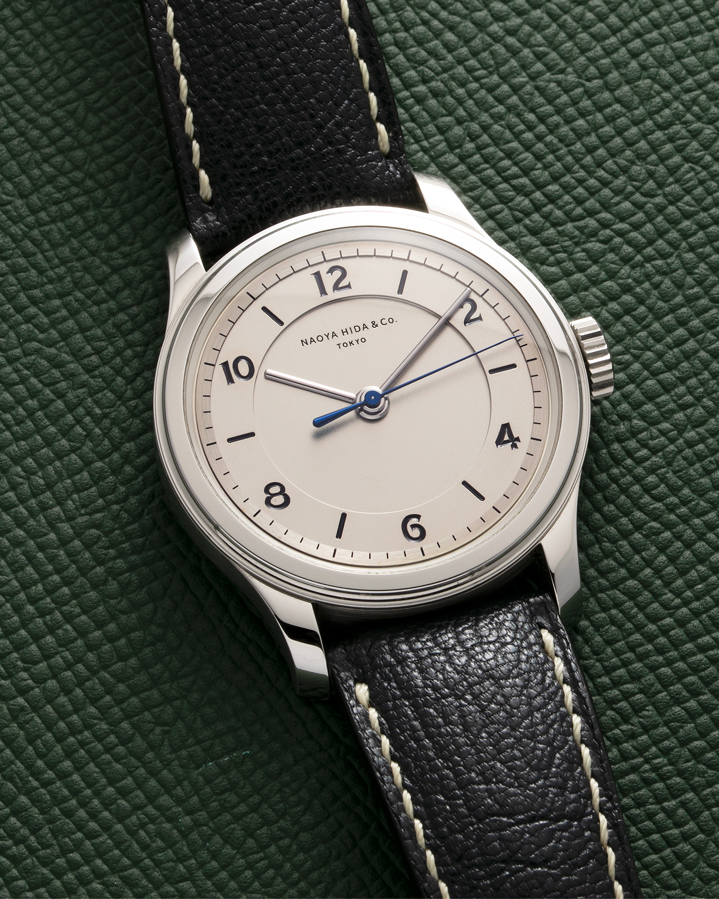 Brand: Naoya Hida Year: 2022 Model: NH Type 2B Material: 904L Stainless Steel Case, German Silver Dial  Movement: Cal. 3020CS, Manual-Winding Case Diameter: 37mm Strap: Naoya Hida (Jean Rousseau) Navy Blue Leather Strap with Contrasting Stitching and Signed Stainless Steel Tang Buckle