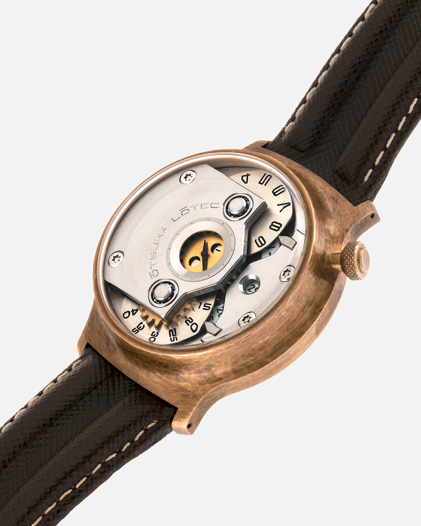 Brand: Otsuka Lotec
Year: 2020
Model: No.5 Bronze R-1 Reika
Material: Hand-Hammered Bronze with Stainless Steel Caseback
Movement: Modified Miyota Calibre 8215
Case Dimensions: 42mm Diameter 13.6mm Thickness
Strap: Brown Otsuka Lotec Leather Strap with Unsigned Otsuka Lotec Stainless Steel Tang Buckle
