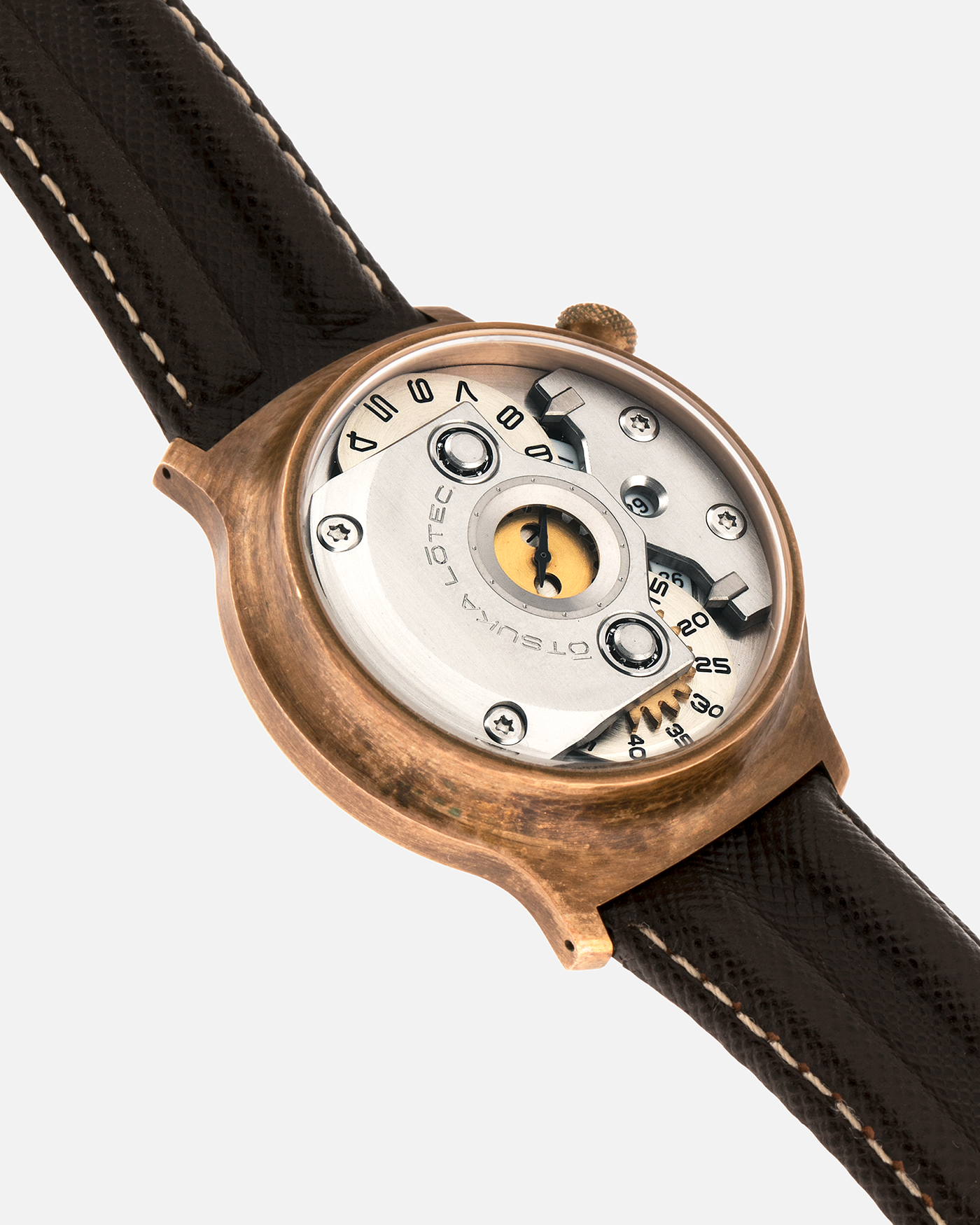 Brand: Otsuka Lotec
Year: 2020
Model: No.5 Bronze R-1 Reika
Material: Hand-Hammered Bronze with Stainless Steel Caseback
Movement: Modified Miyota Calibre 8215
Case Dimensions: 42mm Diameter 13.6mm Thickness
Strap: Brown Otsuka Lotec Leather Strap with Unsigned Otsuka Lotec Stainless Steel Tang Buckle
