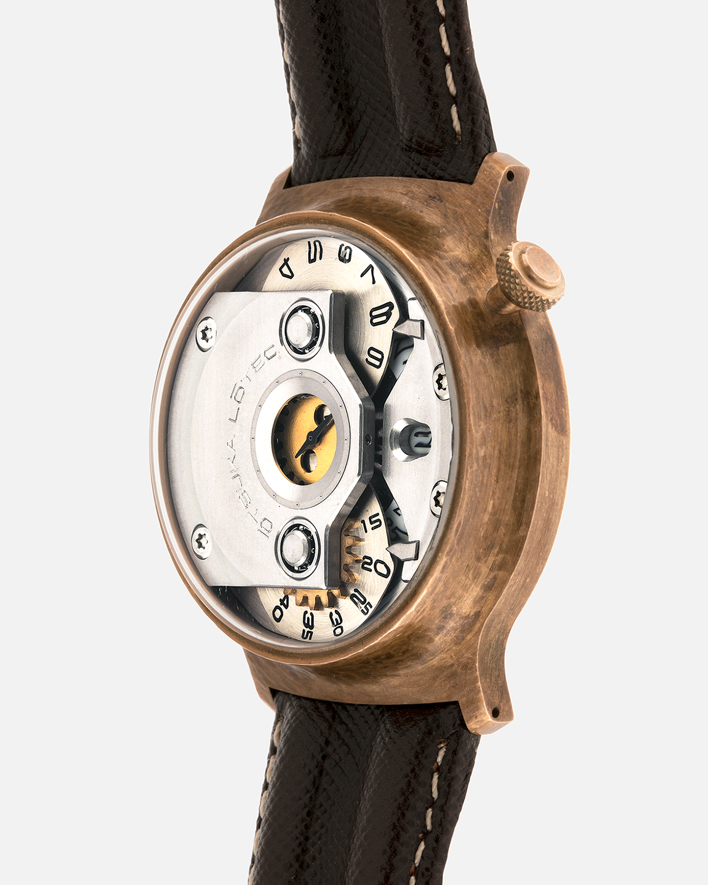 Brand: Otsuka Lotec
Year: 2020
Model: No.5 Bronze R-1 Reika
Material: Hand-Hammered Bronze with Stainless Steel Caseback
Movement: Modified Miyota Calibre 8215
Case Dimensions: 42mm Diameter 13.6mm Thickness
Strap: Brown Otsuka Lotec Leather Strap with Unsigned Otsuka Lotec Stainless Steel Tang Buckle