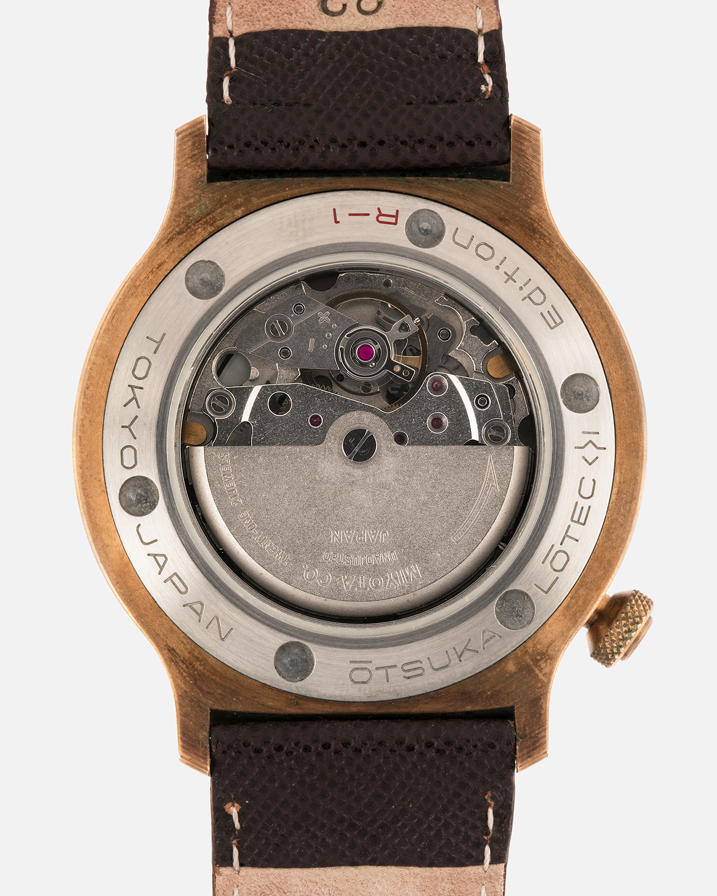 Brand: Otsuka Lotec
Year: 2020
Model: No.5 Bronze R-1 Reika
Material: Hand-Hammered Bronze with Stainless Steel Caseback
Movement: Modified Miyota Calibre 8215
Case Dimensions: 42mm Diameter 13.6mm Thickness
Strap: Brown Otsuka Lotec Leather Strap with Unsigned Otsuka Lotec Stainless Steel Tang Buckle