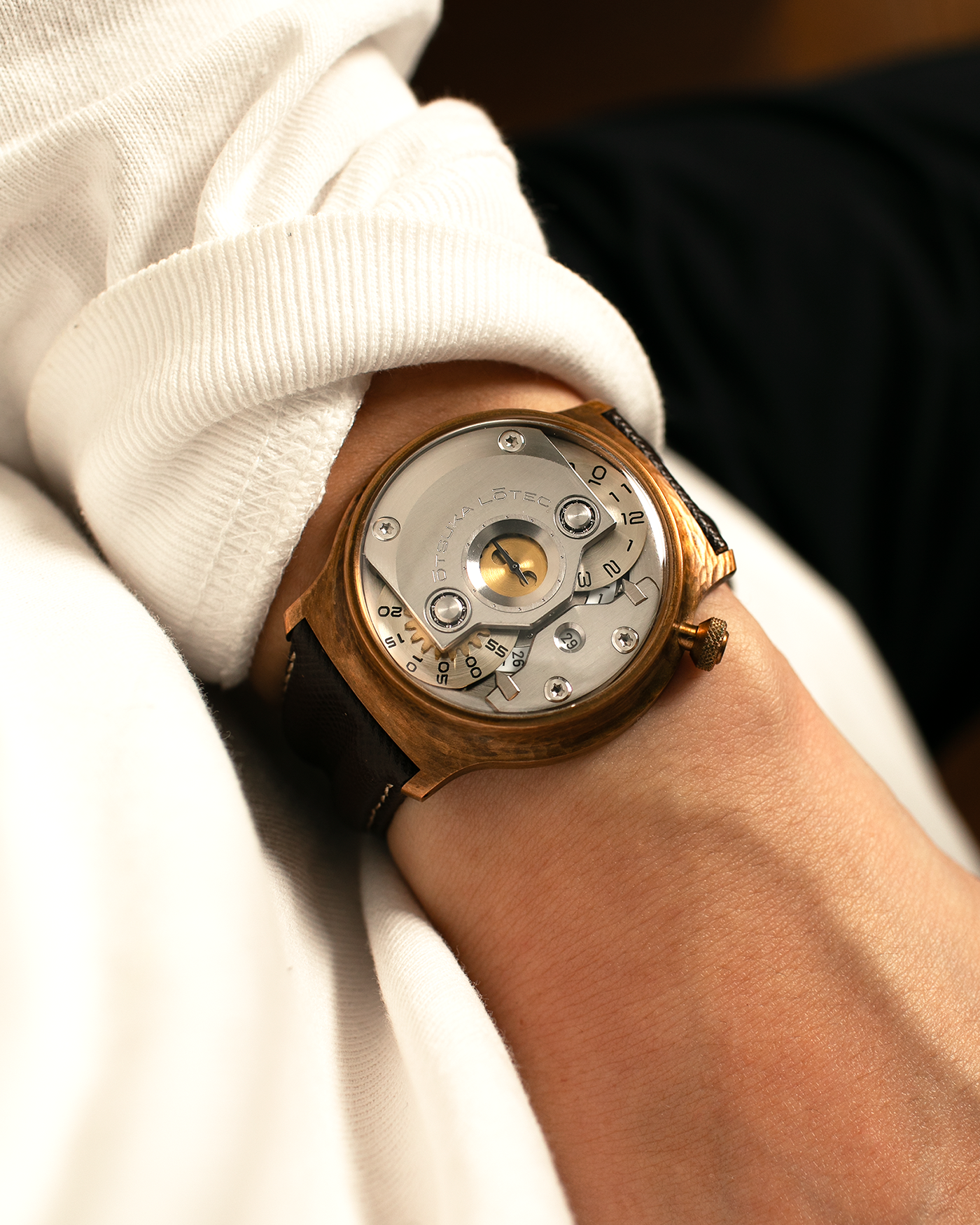 Brand: Otsuka Lotec
Year: 2020
Model: No.5 Bronze R-1 Reika
Material: Hand-Hammered Bronze with Stainless Steel Caseback
Movement: Modified Miyota Calibre 8215
Case Dimensions: 42mm Diameter 13.6mm Thickness
Strap: Brown Otsuka Lotec Leather Strap with Unsigned Otsuka Lotec Stainless Steel Tang Buckle
