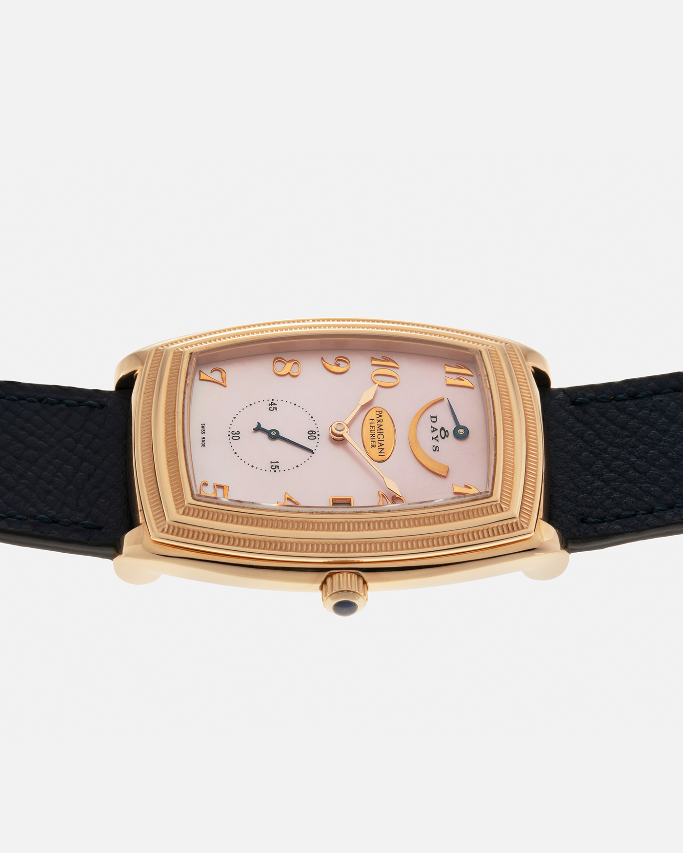 Brand: Parmigiani Fleurier
Year: 2000s
Model: Ionica Hebdomadaire 8-Days ‘Mother-of-Pearl’
Material: 18-carat Rose Gold, Mother-of-Pearl Dial
Movement: Parmigiani Fleurier Cal. PF 110, Manual-Winding
Case Dimensions: 45mm (Including Lugs) x 36mm x 11mm
Lug Width: 20mm
Strap: Nostime Dark Navy Grained Calf Leather Strap with 18-carat Rose Gold Signed Tang Buckle