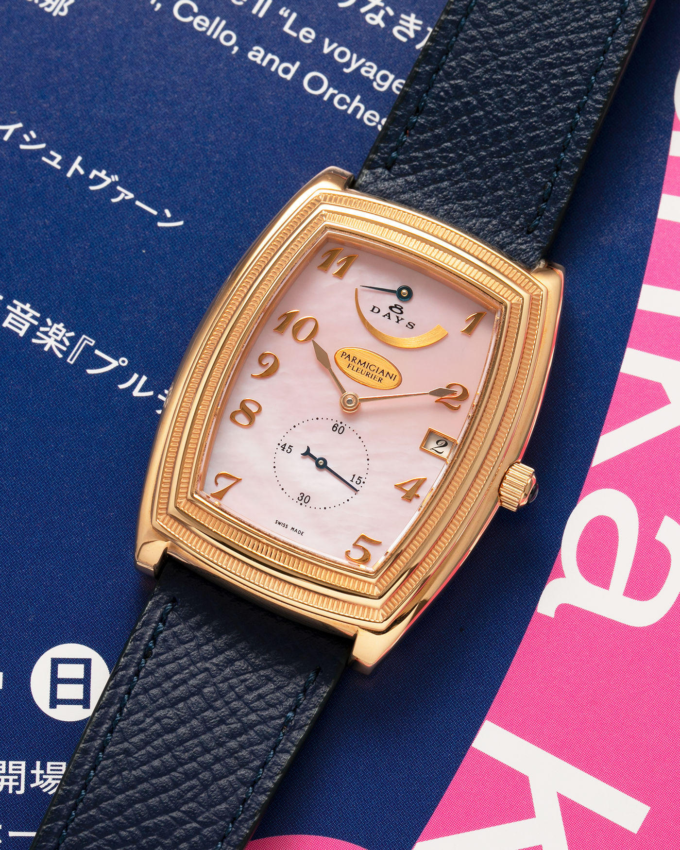 Brand: Parmigiani Fleurier
Year: 2000s
Model: Ionica Hebdomadaire 8-Days ‘Mother-of-Pearl’
Material: 18-carat Rose Gold, Mother-of-Pearl Dial
Movement: Parmigiani Fleurier Cal. PF 110, Manual-Winding
Case Dimensions: 45mm (Including Lugs) x 36mm x 11mm
Lug Width: 20mm
Strap: Nostime Dark Navy Grained Calf Leather Strap with 18-carat Rose Gold Signed Tang Buckle