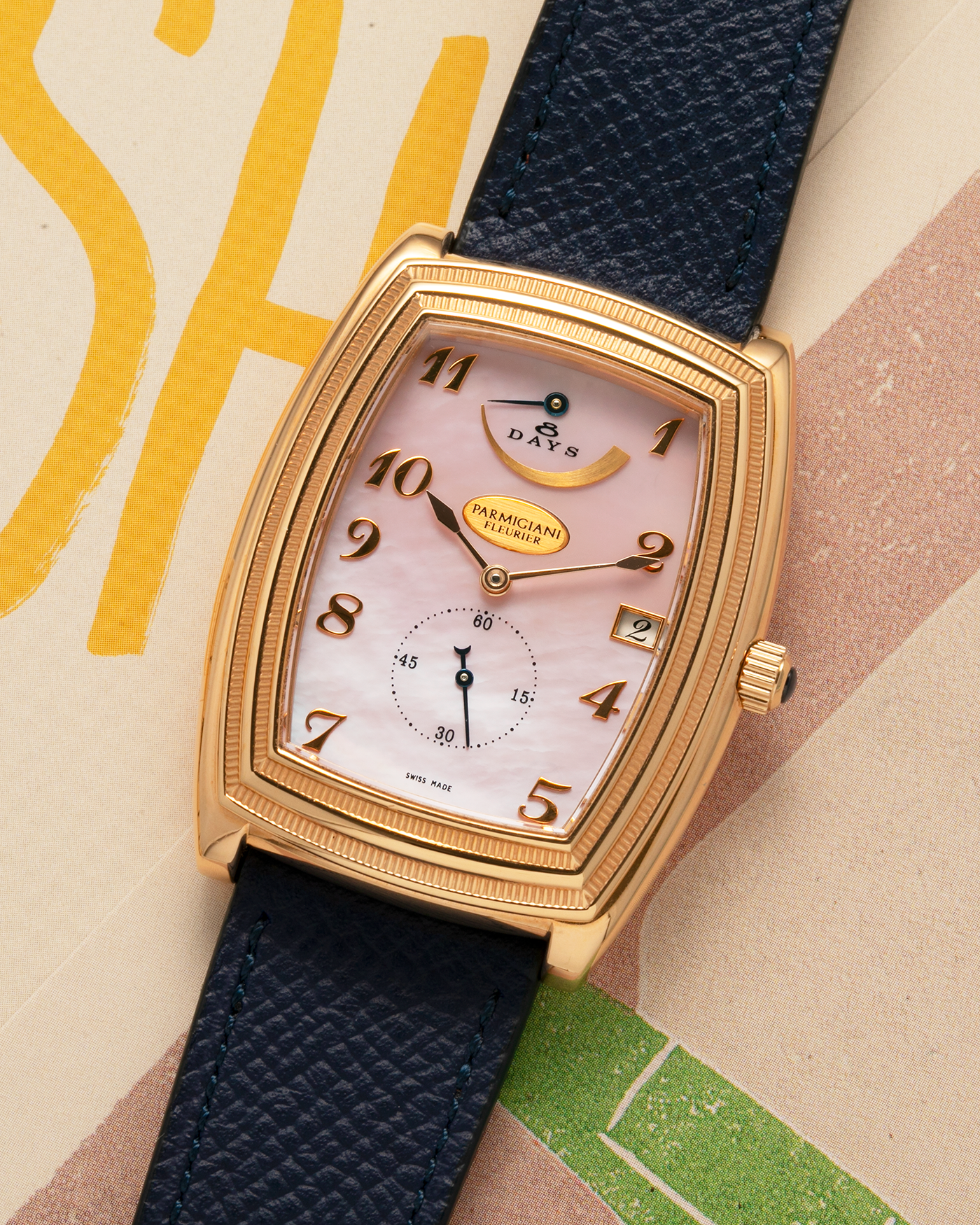 Brand: Parmigiani Fleurier
Year: 2000s
Model: Ionica Hebdomadaire 8-Days ‘Mother-of-Pearl’
Material: 18-carat Rose Gold, Mother-of-Pearl Dial
Movement: Parmigiani Fleurier Cal. PF 110, Manual-Winding
Case Dimensions: 45mm (Including Lugs) x 36mm x 11mm
Lug Width: 20mm
Strap: Nostime Dark Navy Grained Calf Leather Strap with 18-carat Rose Gold Signed Tang Buckle
