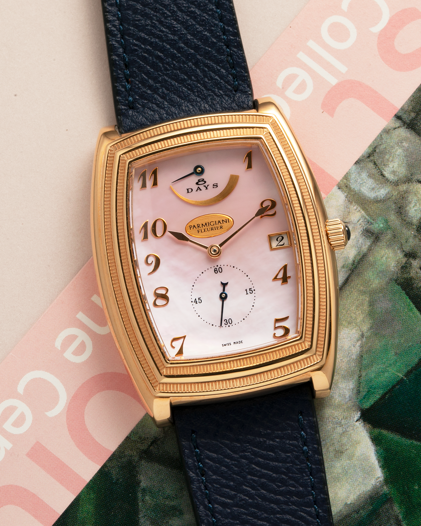 Brand: Parmigiani Fleurier
Year: 2000s
Model: Ionica Hebdomadaire 8-Days ‘Mother-of-Pearl’
Material: 18-carat Rose Gold, Mother-of-Pearl Dial
Movement: Parmigiani Fleurier Cal. PF 110, Manual-Winding
Case Dimensions: 45mm (Including Lugs) x 36mm x 11mm
Lug Width: 20mm
Strap: Nostime Dark Navy Grained Calf Leather Strap with 18-carat Rose Gold Signed Tang Buckle