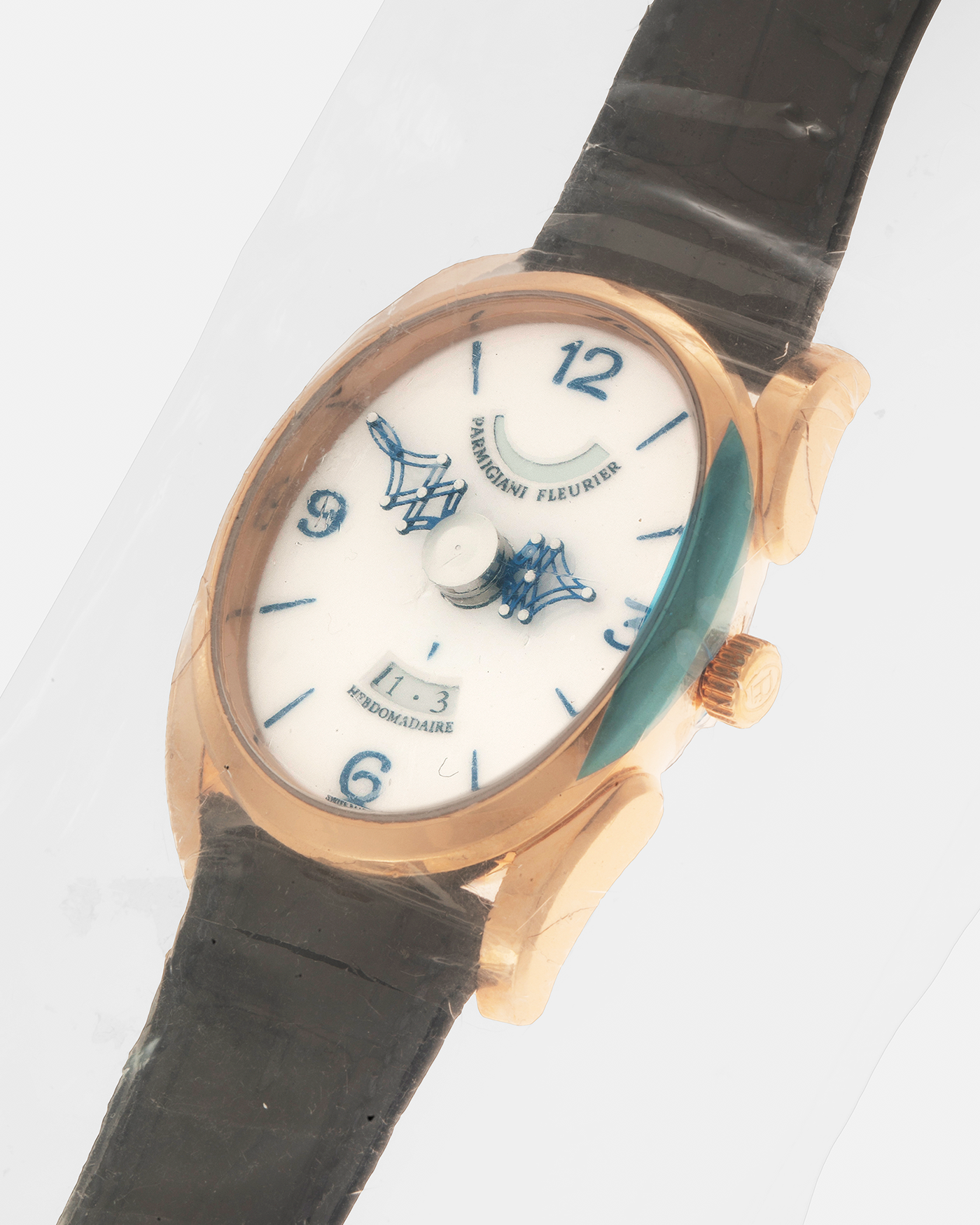 Brand: Parmigiani Fleurier Year: 2021 Model: Ovale Pantographe Material: 18-carat Rose Gold Movement: Parmigiani Fleurier Cal. PF 111, Manual-Winding Case Dimensions: 45mm x 38mm x 12mm Lug Width: 22mm Strap: Parmigiani Fleurer x Hermès Indigo Blue Alligator Leather Strap with 18-carat Rose Gold Signed Tang Buckle