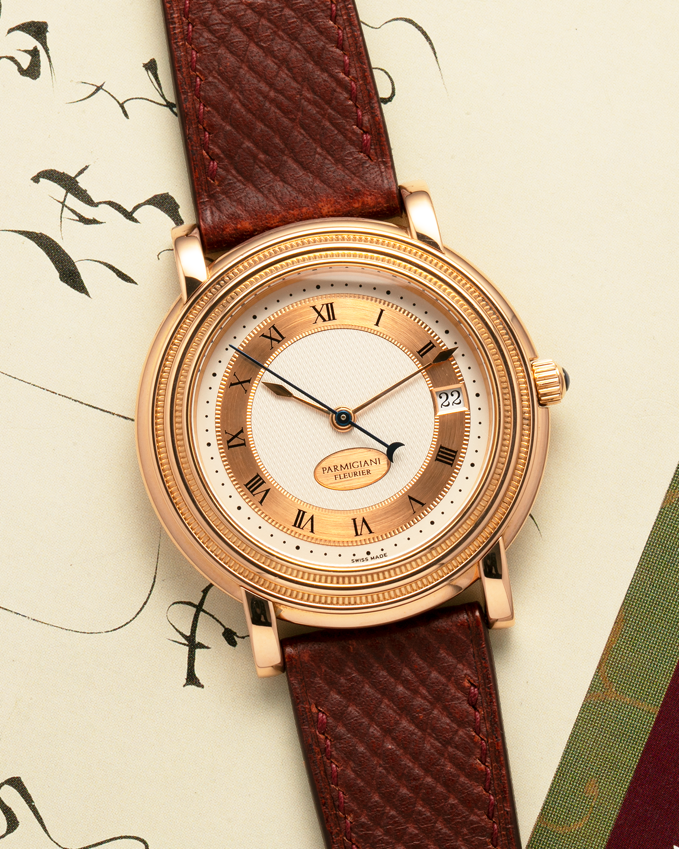 Brand: Parmigiani Fleurier
Year: 1990s
Model: Toric Automatic
Material: 18-carat Rose Gold
Movement: PF Cal. 13301, Self-Winding
Case Dimensions: 40mm x 8mm (Lug-to-Lug 44mm)
Lug Width: 20mm
Strap: Delugs Wine Red Alligator Leather Strap with Signed 18-carat Rose Gold Tang Buckle