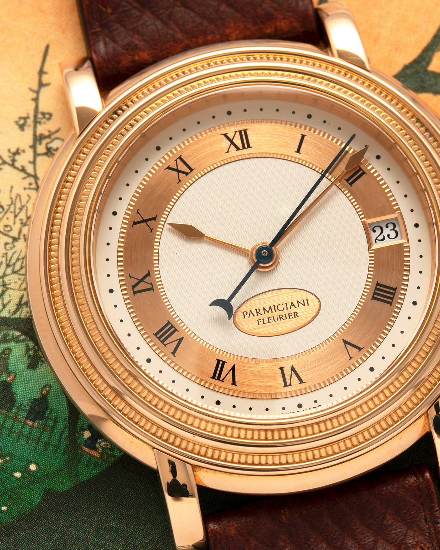 Brand: Parmigiani Fleurier
Year: 1990s
Model: Toric Automatic
Material: 18-carat Rose Gold
Movement: PF Cal. 13301, Self-Winding
Case Dimensions: 40mm x 8mm (Lug-to-Lug 44mm)
Lug Width: 20mm
Strap: Delugs Wine Red Alligator Leather Strap with Signed 18-carat Rose Gold Tang Buckle