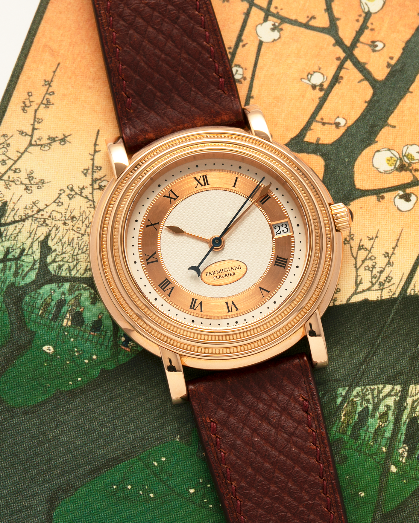 Brand: Parmigiani Fleurier
Year: 1990s
Model: Toric Automatic
Material: 18-carat Rose Gold
Movement: PF Cal. 13301, Self-Winding
Case Dimensions: 40mm x 8mm (Lug-to-Lug 44mm)
Lug Width: 20mm
Strap: Delugs Wine Red Alligator Leather Strap with Signed 18-carat Rose Gold Tang Buckle