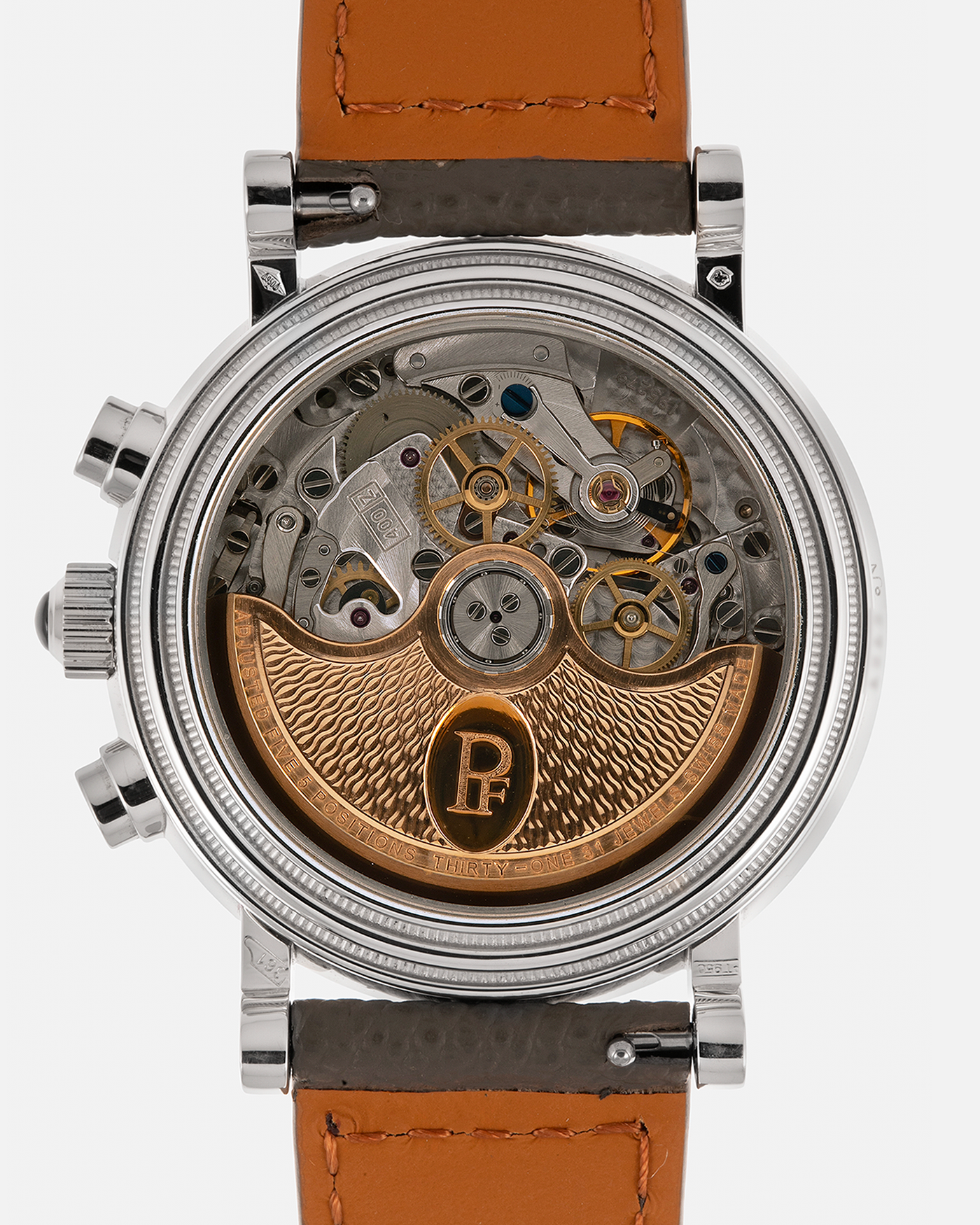 Brand: Parmigiani Fleurier
Year: 2003
Model: Toric Chronograph
Reference: PF006783
Material: Platinum 950
Movement: Parmigiani Fleurier Cal. PF400z (Based on Zenith El Primero 400z), Self-Winding
Case Dimensions: 40mm
Lug Width: 20mm
Strap: Phillips Bacs & Russo Taupe Textured Calf Leather Strap with Signed Platinum 950 Tang Buckle, with extra Parmigiani Fleurier Black Alligator Leather Strap