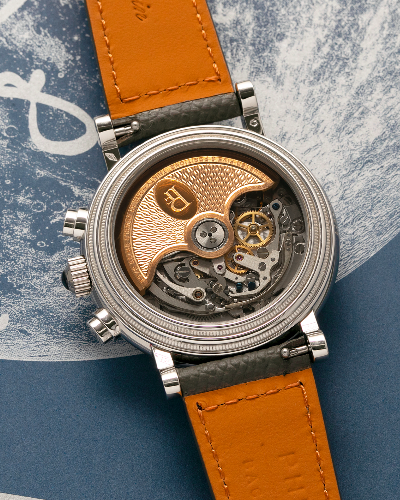 Brand: Parmigiani Fleurier
Year: 2003
Model: Toric Chronograph
Reference: PF006783
Material: Platinum 950
Movement: Parmigiani Fleurier Cal. PF400z (Based on Zenith El Primero 400z), Self-Winding
Case Dimensions: 40mm
Lug Width: 20mm
Strap: Phillips Bacs & Russo Taupe Textured Calf Leather Strap with Signed Platinum 950 Tang Buckle, with extra Parmigiani Fleurier Black Alligator Leather Strap