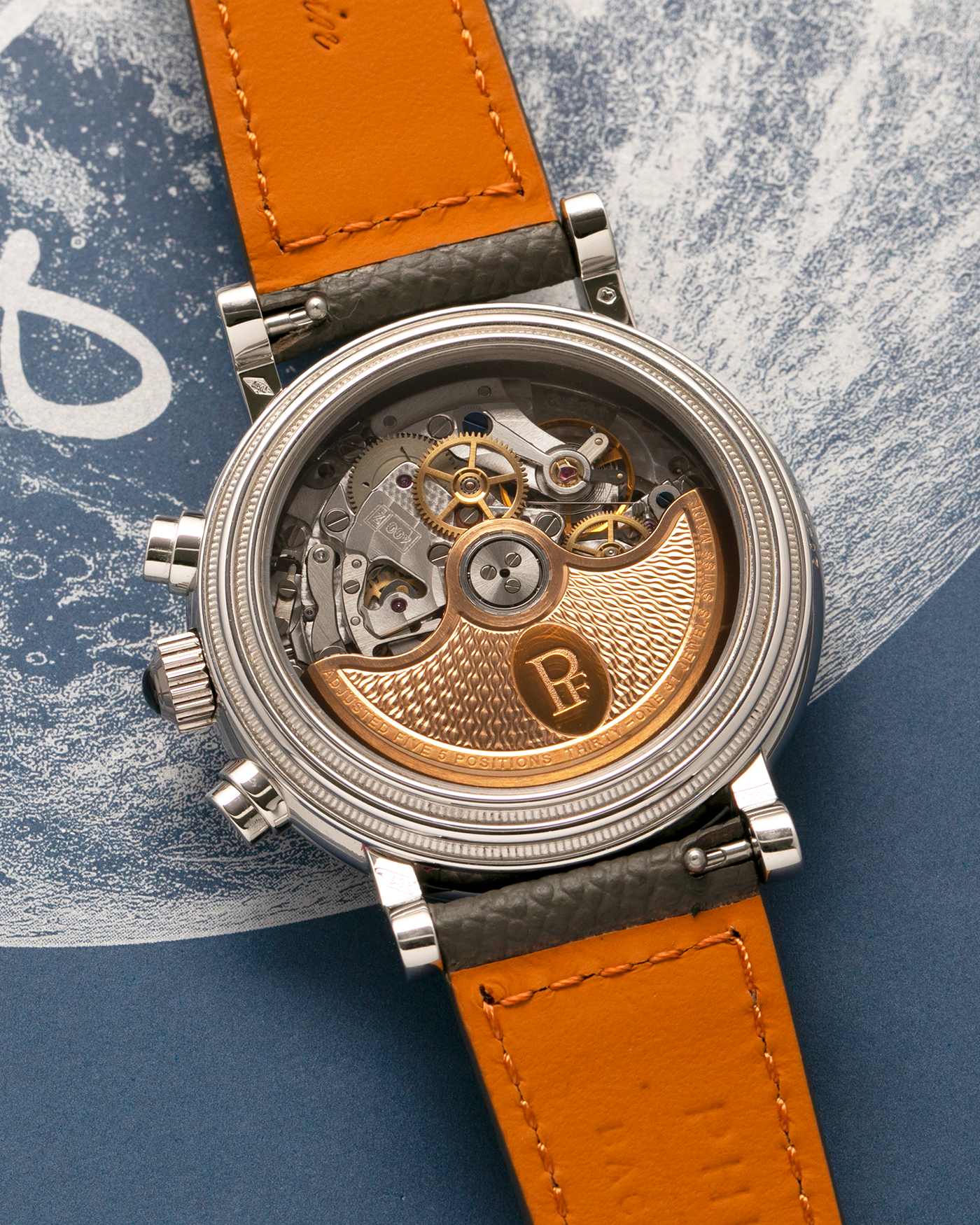 Brand: Parmigiani Fleurier
Year: 2003
Model: Toric Chronograph
Reference: PF006783
Material: Platinum 950
Movement: Parmigiani Fleurier Cal. PF400z (Based on Zenith El Primero 400z), Self-Winding
Case Dimensions: 40mm
Lug Width: 20mm
Strap: Phillips Bacs & Russo Taupe Textured Calf Leather Strap with Signed Platinum 950 Tang Buckle, with extra Parmigiani Fleurier Black Alligator Leather Strap