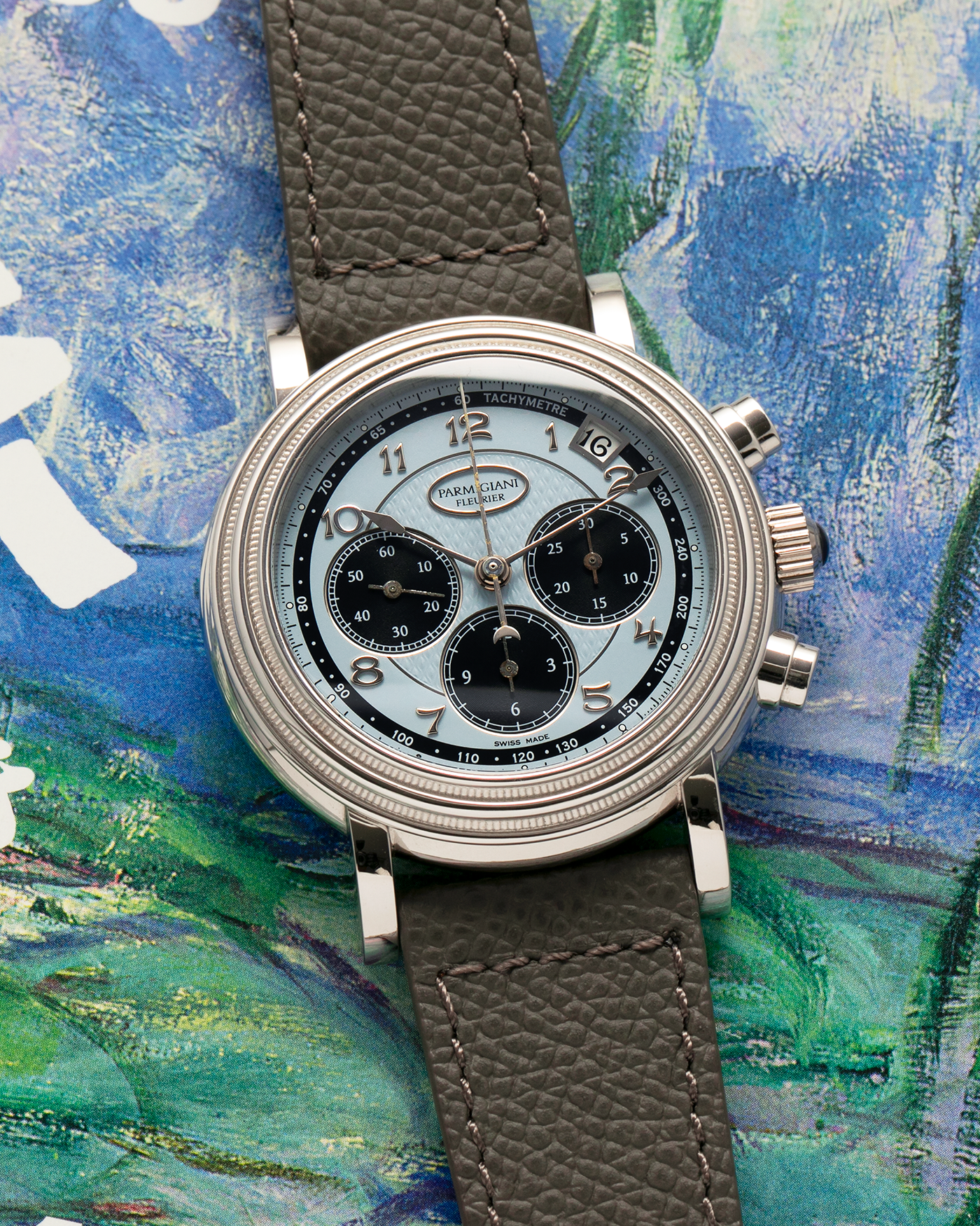 Brand: Parmigiani Fleurier
Year: 2003
Model: Toric Chronograph
Reference: PF006783
Material: Platinum 950
Movement: Parmigiani Fleurier Cal. PF400z (Based on Zenith El Primero 400z), Self-Winding
Case Dimensions: 40mm
Lug Width: 20mm
Strap: Phillips Bacs & Russo Taupe Textured Calf Leather Strap with Signed Platinum 950 Tang Buckle, with extra Parmigiani Fleurier Black Alligator Leather Strap