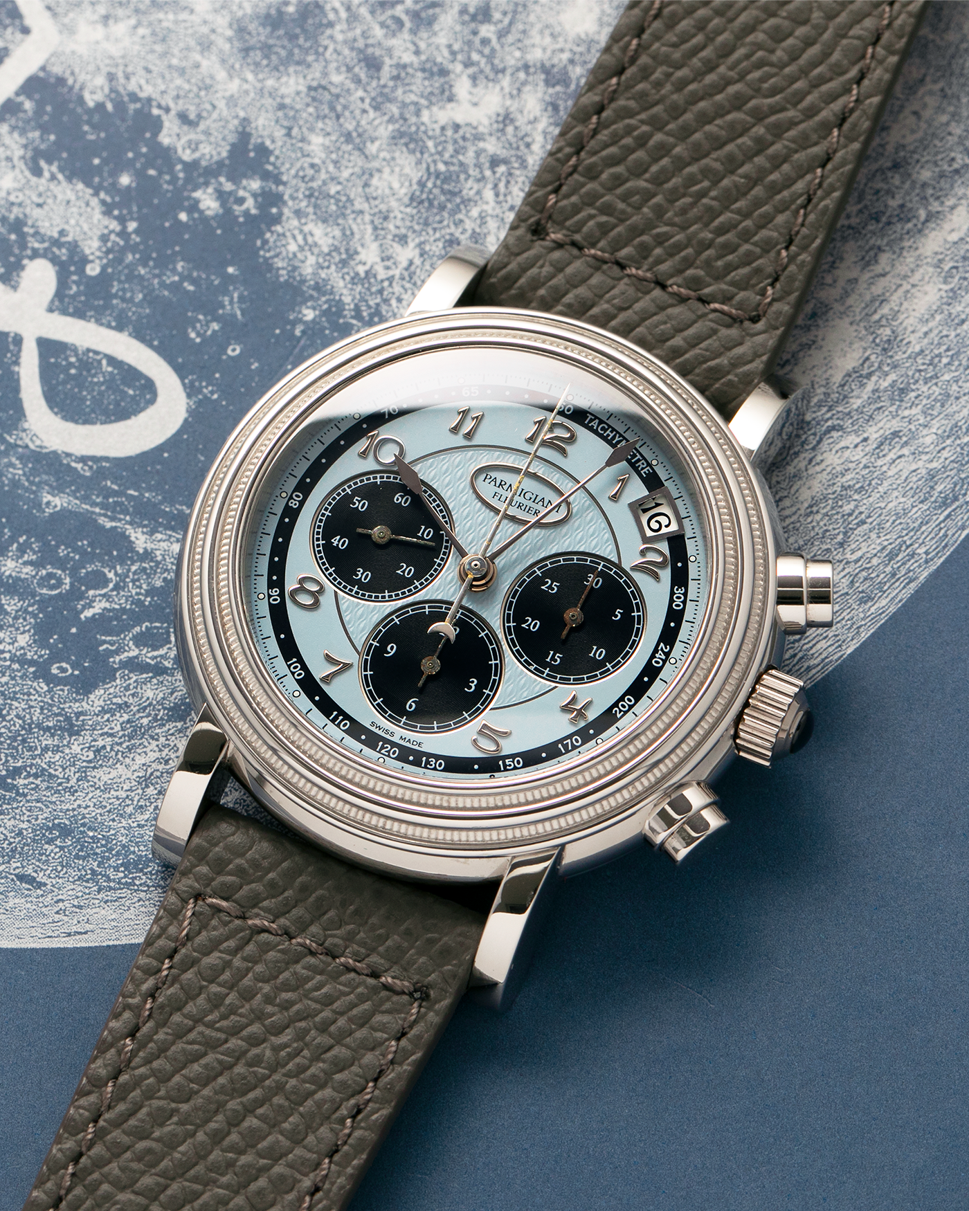Brand: Parmigiani Fleurier
Year: 2003
Model: Toric Chronograph
Reference: PF006783
Material: Platinum 950
Movement: Parmigiani Fleurier Cal. PF400z (Based on Zenith El Primero 400z), Self-Winding
Case Dimensions: 40mm
Lug Width: 20mm
Strap: Phillips Bacs & Russo Taupe Textured Calf Leather Strap with Signed Platinum 950 Tang Buckle, with extra Parmigiani Fleurier Black Alligator Leather Strap