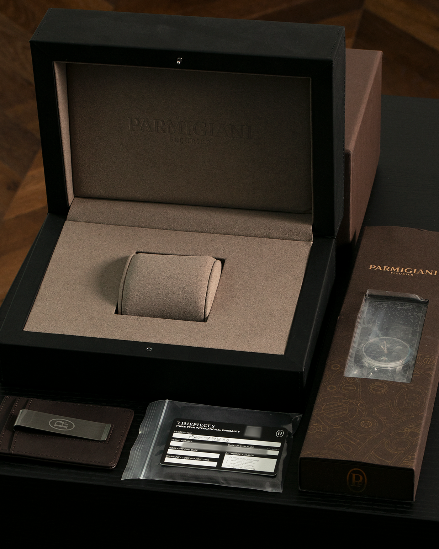 Brand: Parmigiani Fleurier
Year: 2023
Model: Toric Hemisphères Rétrograde
Reference: PFC493-0001400-XA1442
Material: Stainless Steel Case, 18-carat Pink Gold Accents
Movement: Parmigiani Fleurier Cal. 317, Self-Winding
Case Dimensions: 42.8mm x 14.16mm (Lug-to-Lug 47.5mm)
Lug Width: 22mm
Strap: Hermès for Parmigiani Fleurier Black Alligator Leather Strap with Stainless Steel Signed Deployant Clasp
