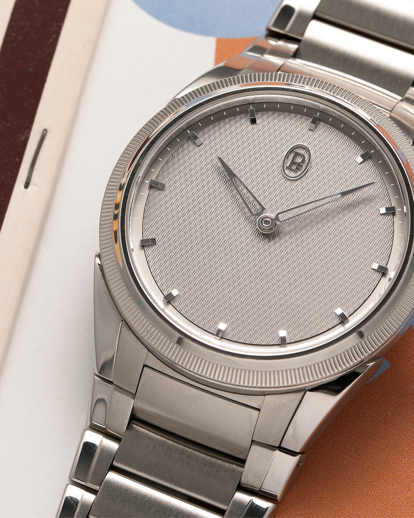 Brand: Parmigiani Fleurier Year: 2023 Model: Tonda PF Silver Sand Material: Stainless Steel Movement: Cal. PF 770, Self-Winding Case Diameter: 36mm Strap: Parmigiani Integrated Stainless Steel Bracelet with Signed Clasp