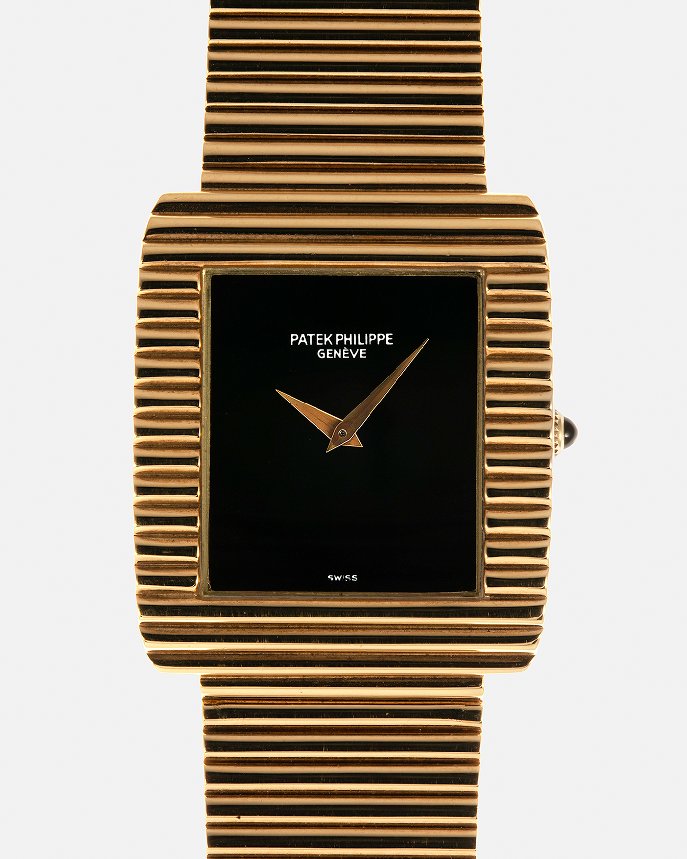 Brand: Patek Philippe
Year: 1976
Model: Gondolo
Reference Number: 3733J
Material: 18-carat Yellow Gold Case, Black Onyx Stone Dial
Movement: Patek Philippe Cal. 215, Manual-Winding
Case Dimensions: 29mm x 33mm (Including Lugs) x 6.5mm
Bracelet: Patek Philippe Ribbed Integrated Bracelet in 18-carat Yellow Gold with Signed Clasp