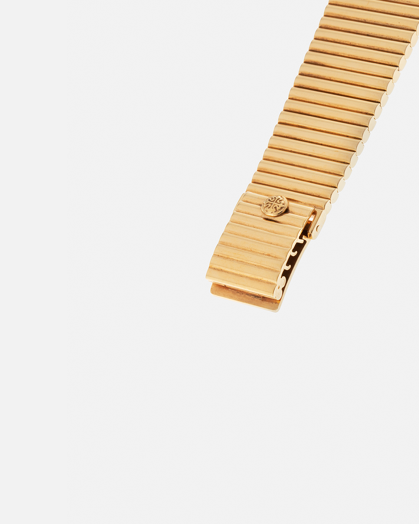 Brand: Patek Philippe
Year: 1976
Model: Gondolo
Reference Number: 3733J
Material: 18-carat Yellow Gold Case, Black Onyx Stone Dial
Movement: Patek Philippe Cal. 215, Manual-Winding
Case Dimensions: 29mm x 33mm (Including Lugs) x 6.5mm
Bracelet: Patek Philippe Ribbed Integrated Bracelet in 18-carat Yellow Gold with Signed Clasp