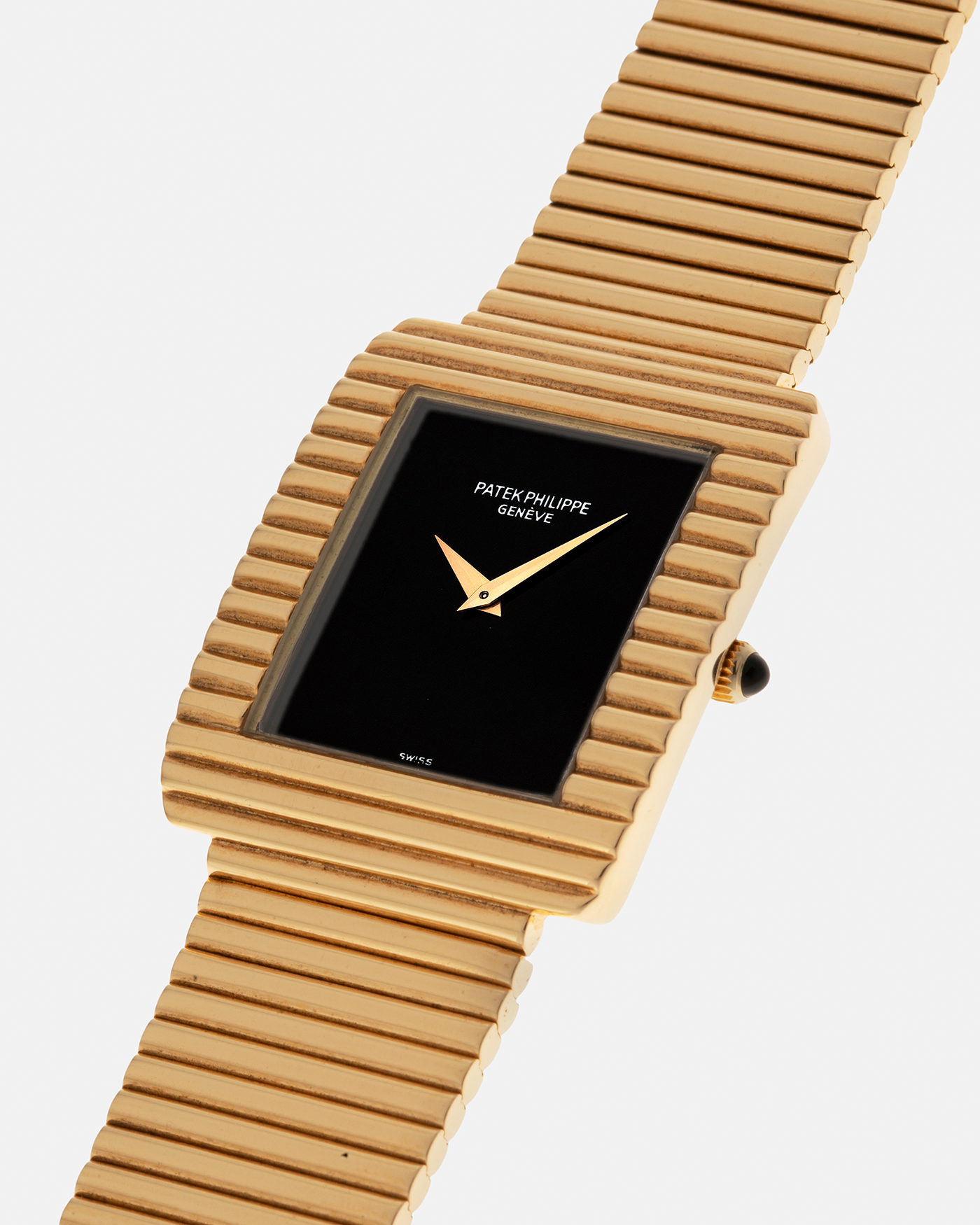 Brand: Patek Philippe
Year: 1976
Model: Gondolo
Reference Number: 3733J
Material: 18-carat Yellow Gold Case, Black Onyx Stone Dial
Movement: Patek Philippe Cal. 215, Manual-Winding
Case Dimensions: 29mm x 33mm (Including Lugs) x 6.5mm
Bracelet: Patek Philippe Ribbed Integrated Bracelet in 18-carat Yellow Gold with Signed Clasp
