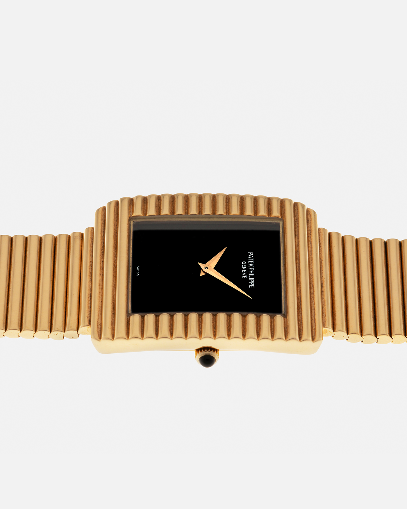 Brand: Patek Philippe
Year: 1976
Model: Gondolo
Reference Number: 3733J
Material: 18-carat Yellow Gold Case, Black Onyx Stone Dial
Movement: Patek Philippe Cal. 215, Manual-Winding
Case Dimensions: 29mm x 33mm (Including Lugs) x 6.5mm
Bracelet: Patek Philippe Ribbed Integrated Bracelet in 18-carat Yellow Gold with Signed Clasp