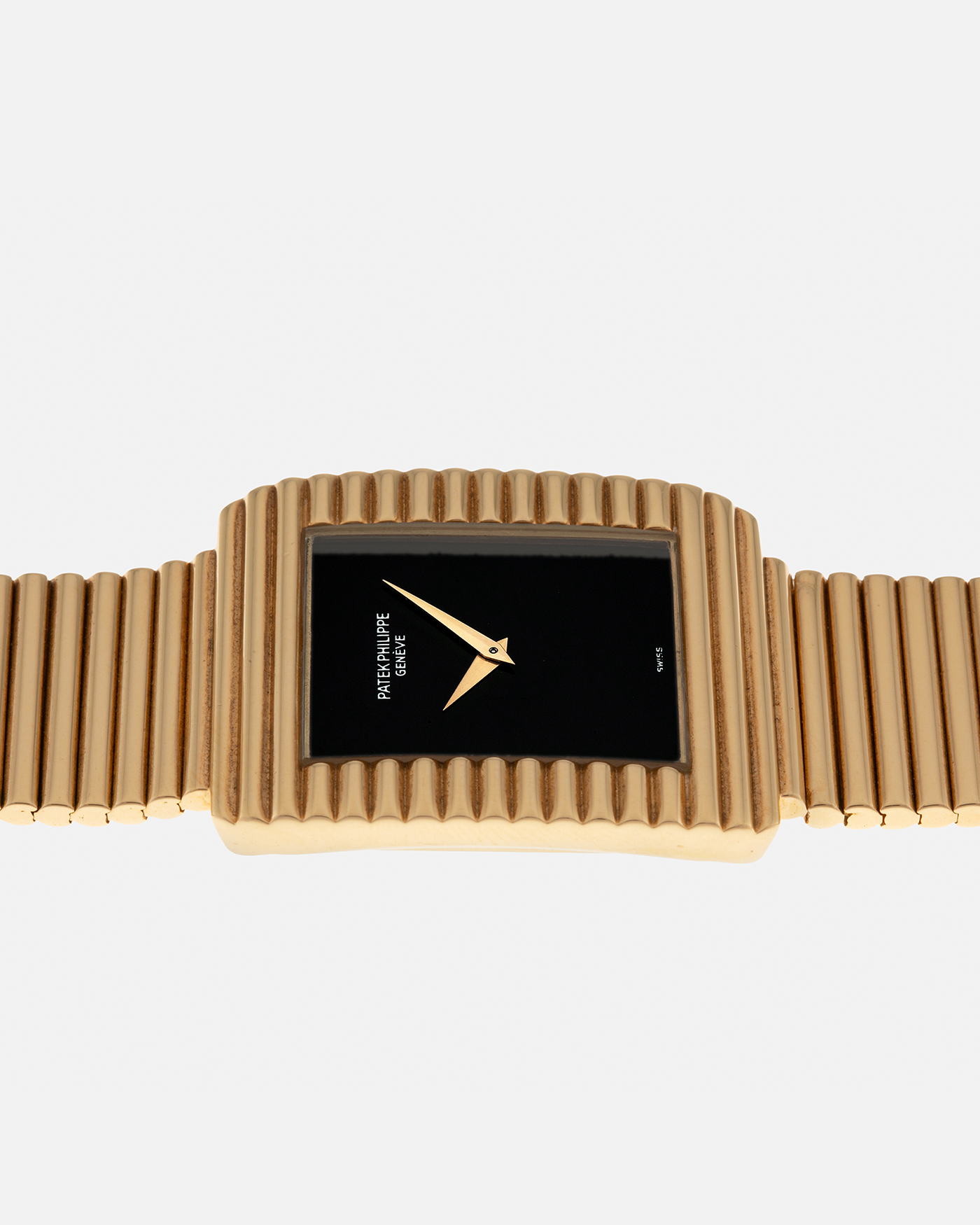 Brand: Patek Philippe
Year: 1976
Model: Gondolo
Reference Number: 3733J
Material: 18-carat Yellow Gold Case, Black Onyx Stone Dial
Movement: Patek Philippe Cal. 215, Manual-Winding
Case Dimensions: 29mm x 33mm (Including Lugs) x 6.5mm
Bracelet: Patek Philippe Ribbed Integrated Bracelet in 18-carat Yellow Gold with Signed Clasp