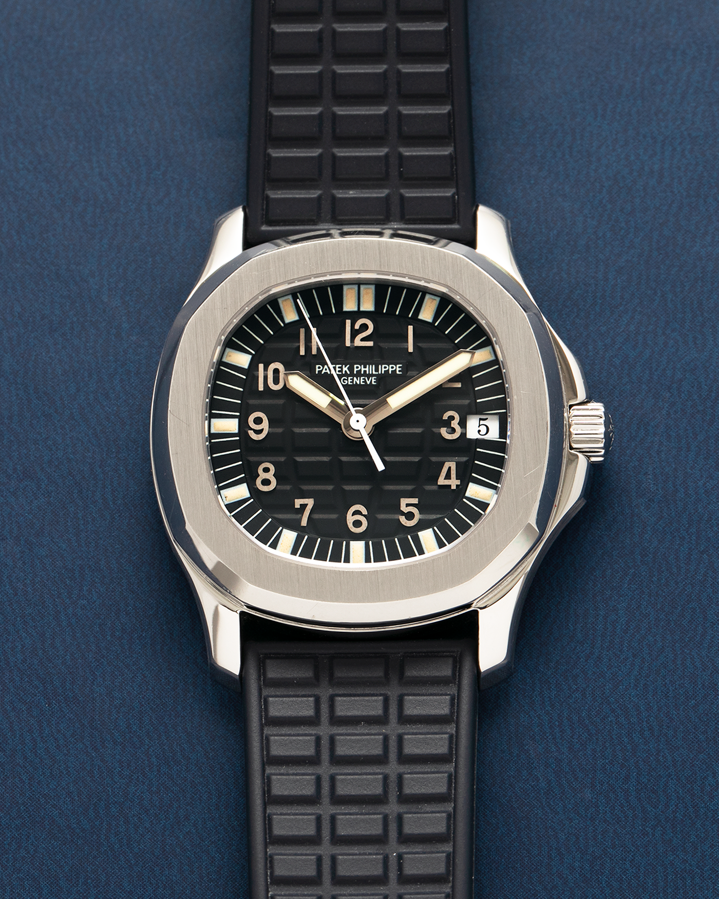 Brand: Patek Philippe
Year: 1997
Model: Aquanaut
Reference: 5060A
Material: Stainless Steel
Movement: Patek Philippe Cal. 330 SC, Self-Winding
Case Dimensions: 36mm x 8.5mm (Lug-to-Lug 46mm)
Lug Width: 19mm
Straps: Patek Philippe Black ‘Tropic’ Rubber Strap for Aquanaut with Signed Stainless Steel Butterfly Double Fold Deployant Clasp, extra uncut Patek Philippe Khaki Green ‘Tropic’ Rubber Strap for Aquanaut