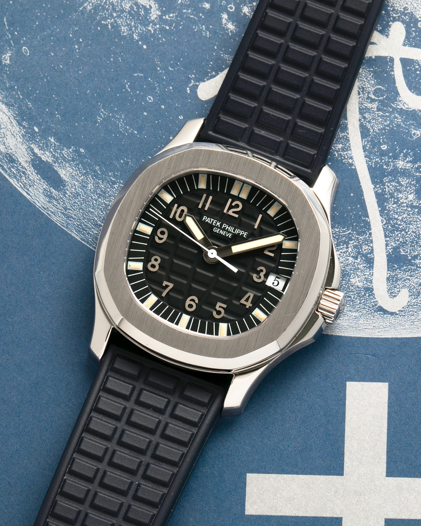 Brand: Patek Philippe
Year: 1997
Model: Aquanaut
Reference: 5060A
Material: Stainless Steel
Movement: Patek Philippe Cal. 330 SC, Self-Winding
Case Dimensions: 36mm x 8.5mm (Lug-to-Lug 46mm)
Lug Width: 19mm
Straps: Patek Philippe Black ‘Tropic’ Rubber Strap for Aquanaut with Signed Stainless Steel Butterfly Double Fold Deployant Clasp, extra uncut Patek Philippe Khaki Green ‘Tropic’ Rubber Strap for Aquanaut