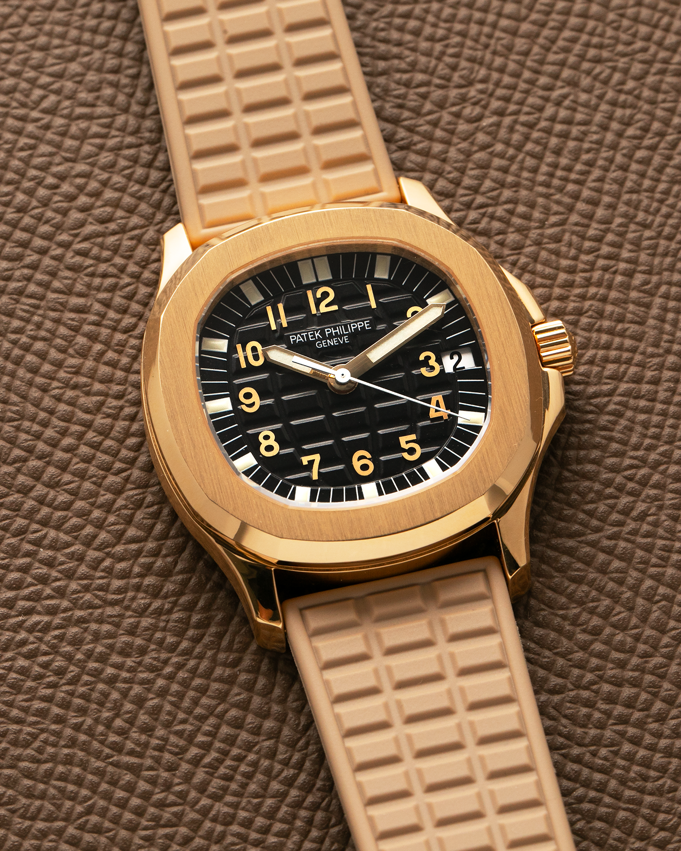 Brand: Patek Philippe
Year: 2004
Model: Aquanaut
Reference: 5066J
Material: 18k Yellow Gold
Movement: Patek Philippe Cal. 330 SC, Self-Winding
Case Dimensions: 36mm x 8.5mm
Lug Width: 19mm
Straps: Patek Philippe Beige ‘Tropic’ Rubber Strap with Signed 18k Yellow Gold Butterfly Double Fold Deployant Clasp. Extra Patek Philippe Khaki Green Rubber Strap.
