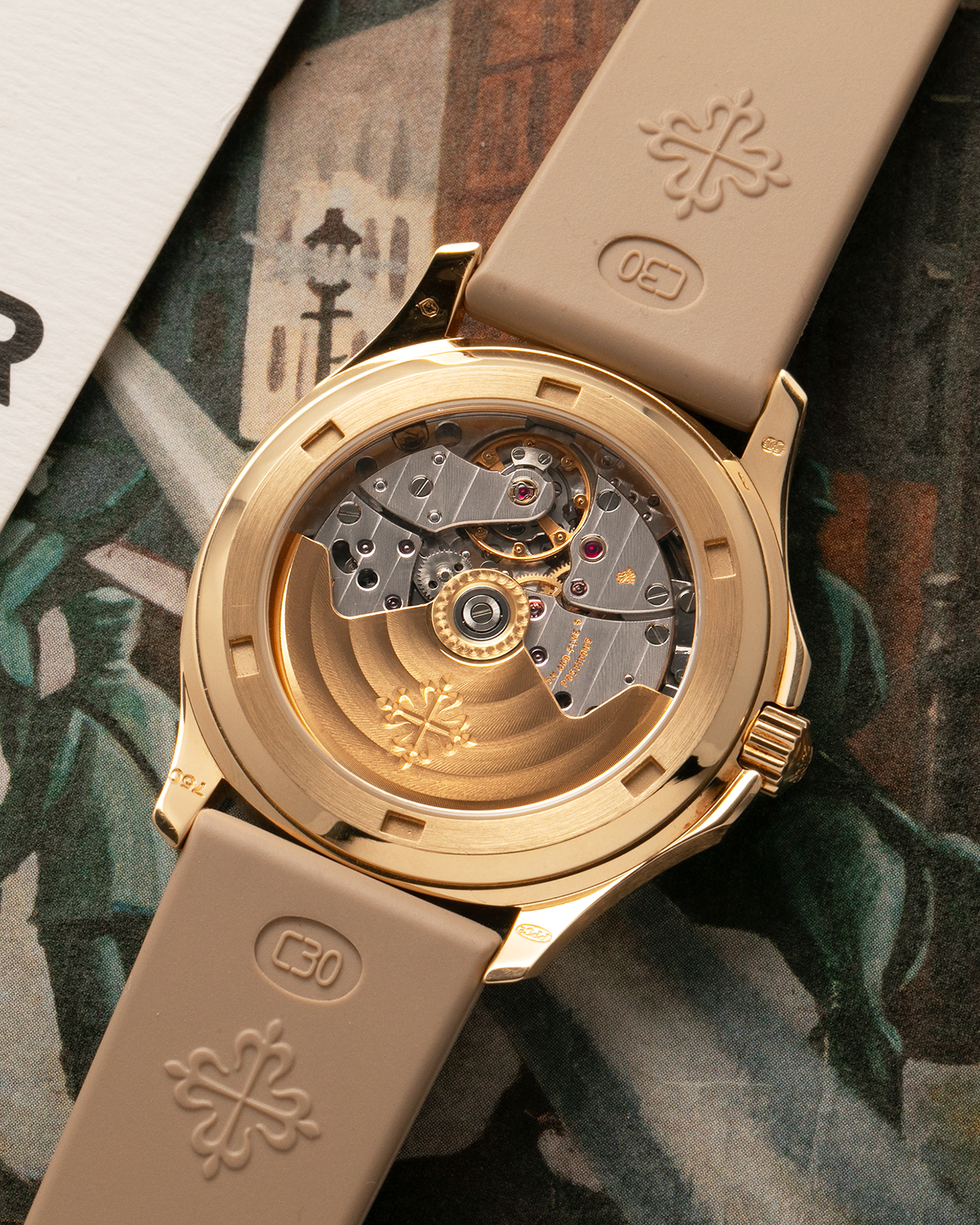 Brand: Patek Philippe
Year: 2004
Model: Aquanaut
Reference: 5066J
Material: 18k Yellow Gold
Movement: Patek Philippe Cal. 330 SC, Self-Winding
Case Dimensions: 36mm x 8.5mm
Lug Width: 19mm
Straps: Patek Philippe Beige ‘Tropic’ Rubber Strap with Signed 18k Yellow Gold Butterfly Double Fold Deployant Clasp. Extra Patek Philippe Khaki Green Rubber Strap.