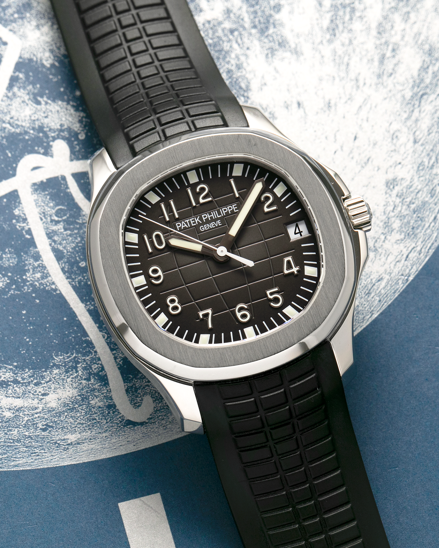 Brand: Patek Philippe
Year: 2000’s
Model: Aquanaut
Reference Number: 5165A
Material: Stainless Steel
Movement: Patek Philippe Cal. 324 S C, Self-Winding
Case Dimensions: 38mm x 8.5mm (Lug-to-Lug 44.5mm)
Straps: Patek Philippe Aquanaut Black Rubber Strap with Signed Deployant Clasp, with an extra Brand New Uncut Patek Philippe Aquanaut Black Rubber Strap