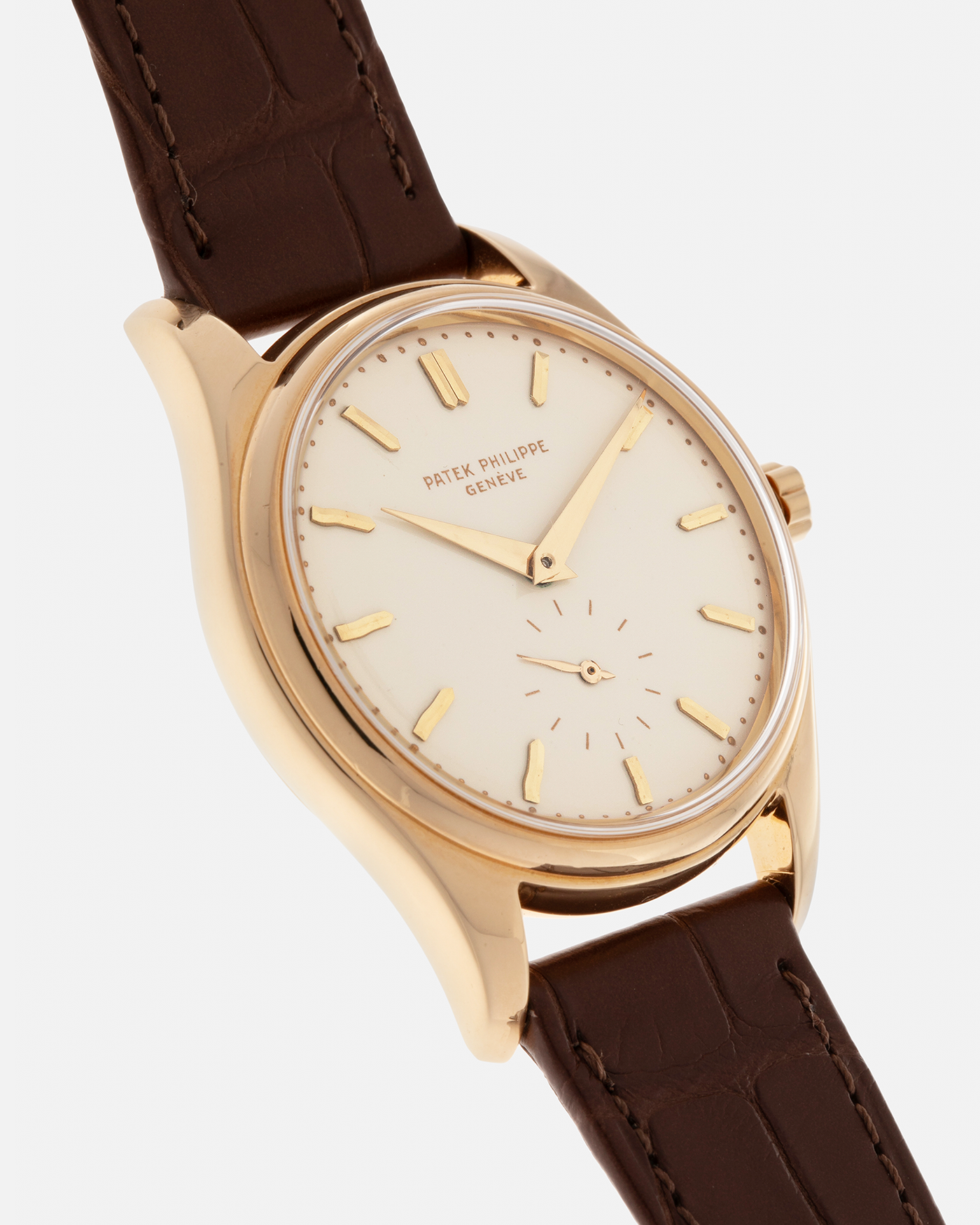 Brand: Patek Philippe
Year: 1957
Model: Calatrava
Reference: 2526, Third Series
Material: 18-carat Yellow Gold
Movement: Patek Philippe Cal. 12-600AT, Self-Winding
Case Dimensions: 36mm x 11.3mm (Lug-to-Lug 44mm)
Lug Width: 18mm
Strap: Patek Philippe Brown Calf Leather Strap with Signed 18-carat Yellow Gold Tang Buckle