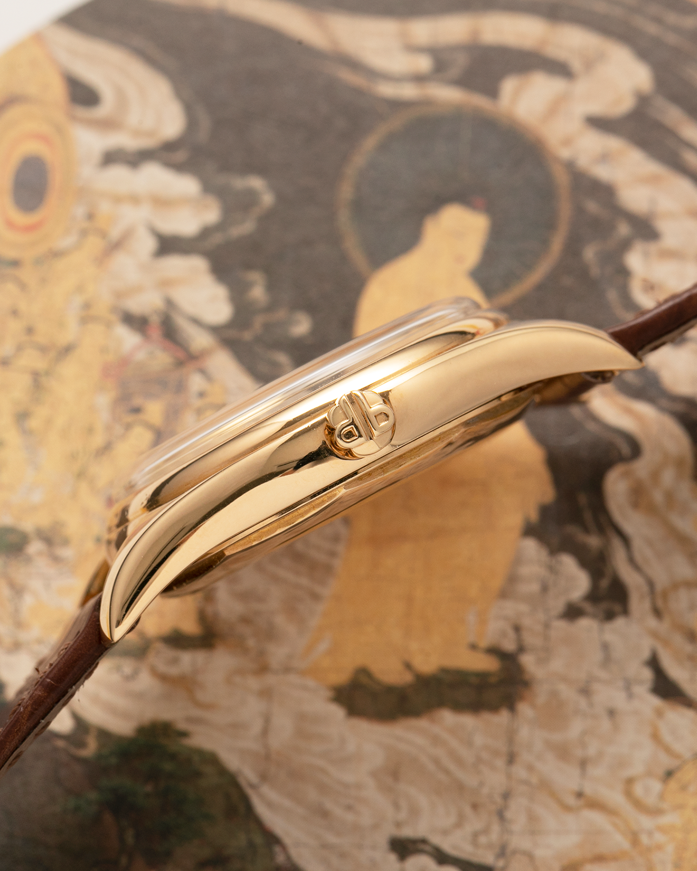 Brand: Patek Philippe
Year: 1957
Model: Calatrava
Reference: 2526, Third Series
Material: 18-carat Yellow Gold
Movement: Patek Philippe Cal. 12-600AT, Self-Winding
Case Dimensions: 36mm x 11.3mm (Lug-to-Lug 44mm)
Lug Width: 18mm
Strap: Patek Philippe Brown Calf Leather Strap with Signed 18-carat Yellow Gold Tang Buckle