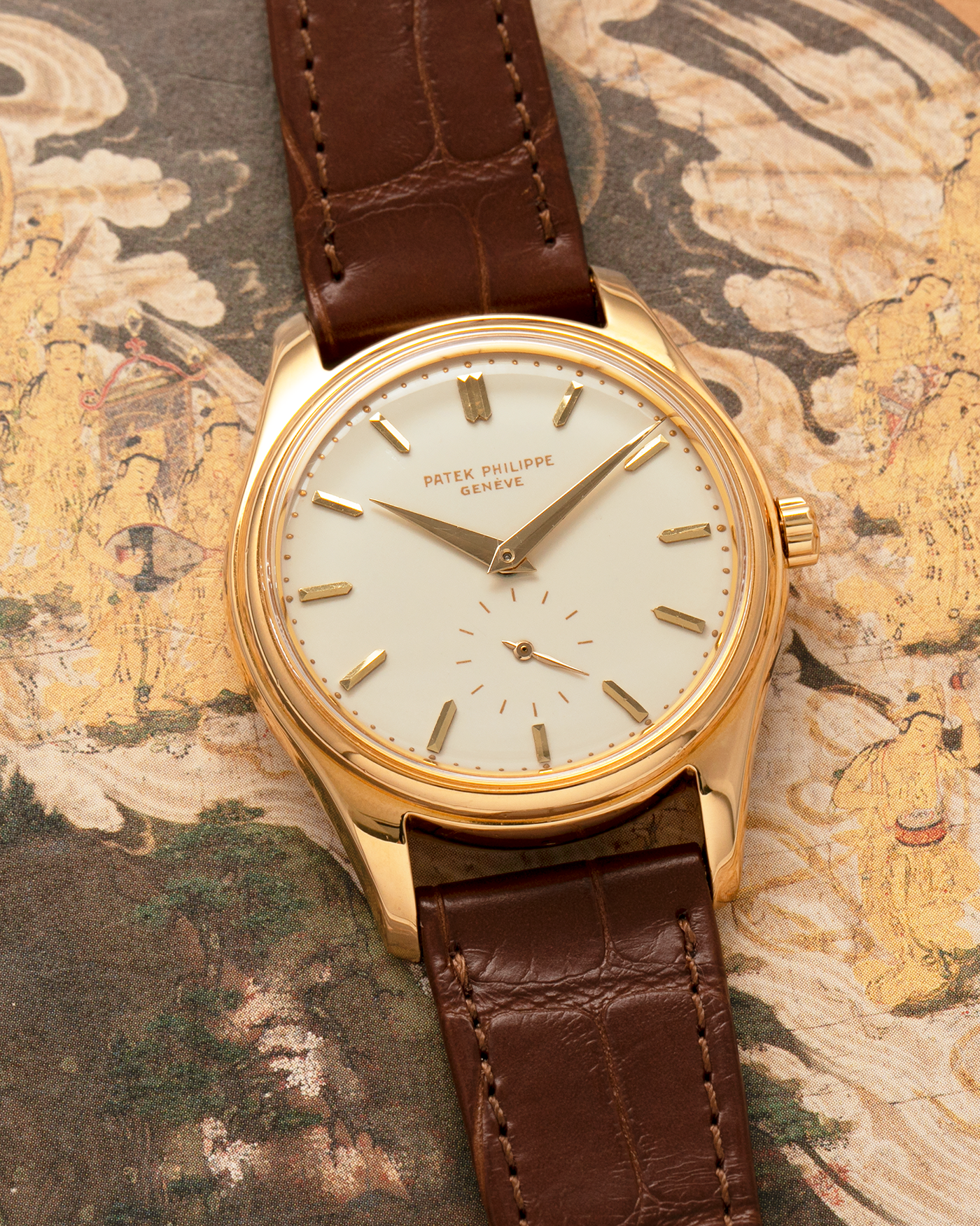 Brand: Patek Philippe
Year: 1957
Model: Calatrava
Reference: 2526, Third Series
Material: 18-carat Yellow Gold
Movement: Patek Philippe Cal. 12-600AT, Self-Winding
Case Dimensions: 36mm x 11.3mm (Lug-to-Lug 44mm)
Lug Width: 18mm
Strap: Patek Philippe Brown Calf Leather Strap with Signed 18-carat Yellow Gold Tang Buckle