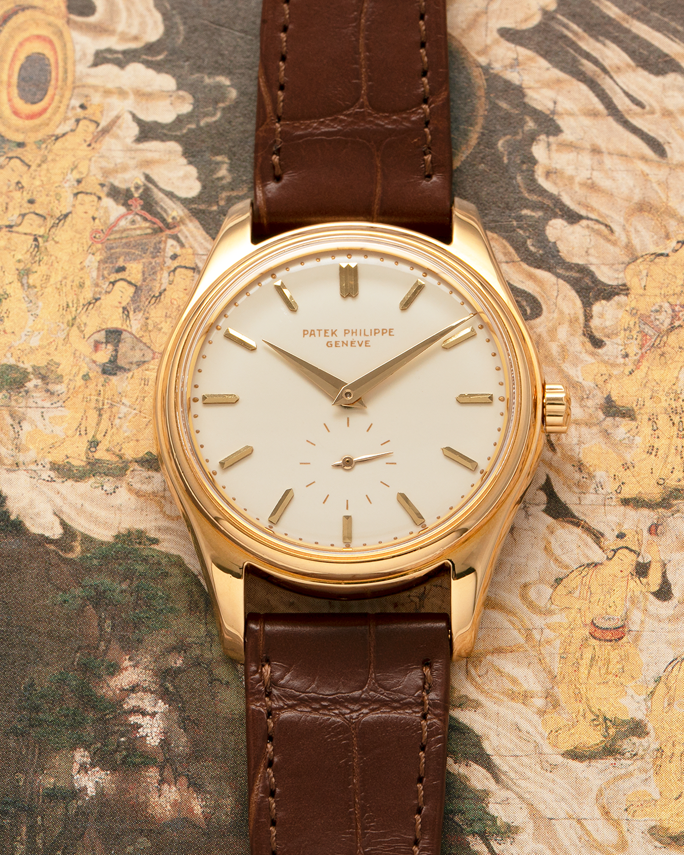 Brand: Patek Philippe
Year: 1957
Model: Calatrava
Reference: 2526, Third Series
Material: 18-carat Yellow Gold
Movement: Patek Philippe Cal. 12-600AT, Self-Winding
Case Dimensions: 36mm x 11.3mm (Lug-to-Lug 44mm)
Lug Width: 18mm
Strap: Patek Philippe Brown Calf Leather Strap with Signed 18-carat Yellow Gold Tang Buckle