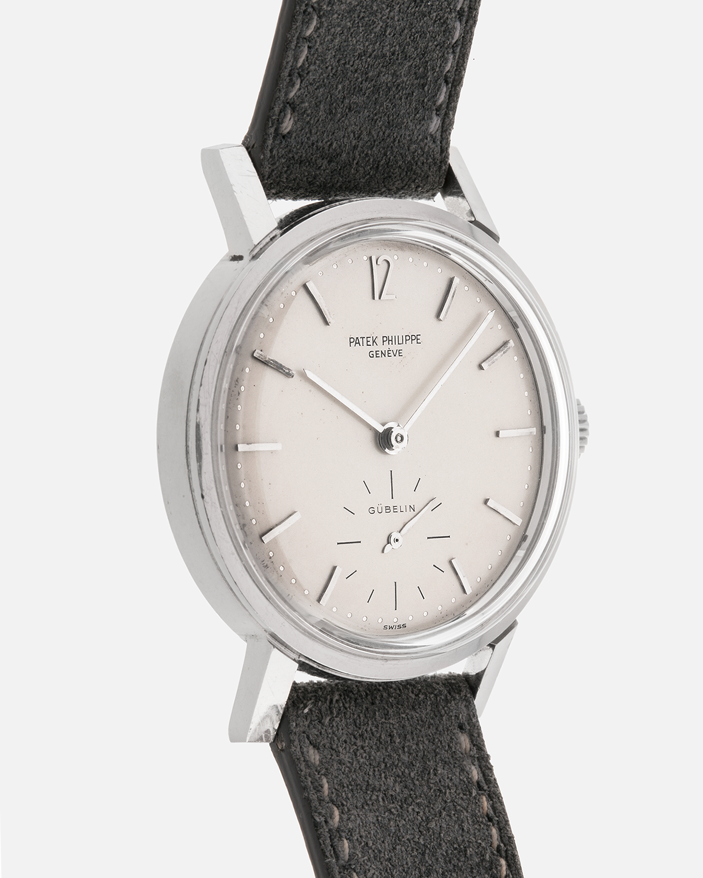 Brand: Patek Philippe
Year: 1966
Model: Calatrava, Gubelin Signed
Reference: 3417
Material: Stainless Steel
Movement: Patek Philippe Cal. 27-AM 400
Case Dimensions: 35mm Diameter 11mm Thickness
Lug Width: 18mm
Strap: Dream Rocketeers Grey Suede Strap with Generic Stainless Steel Buckle