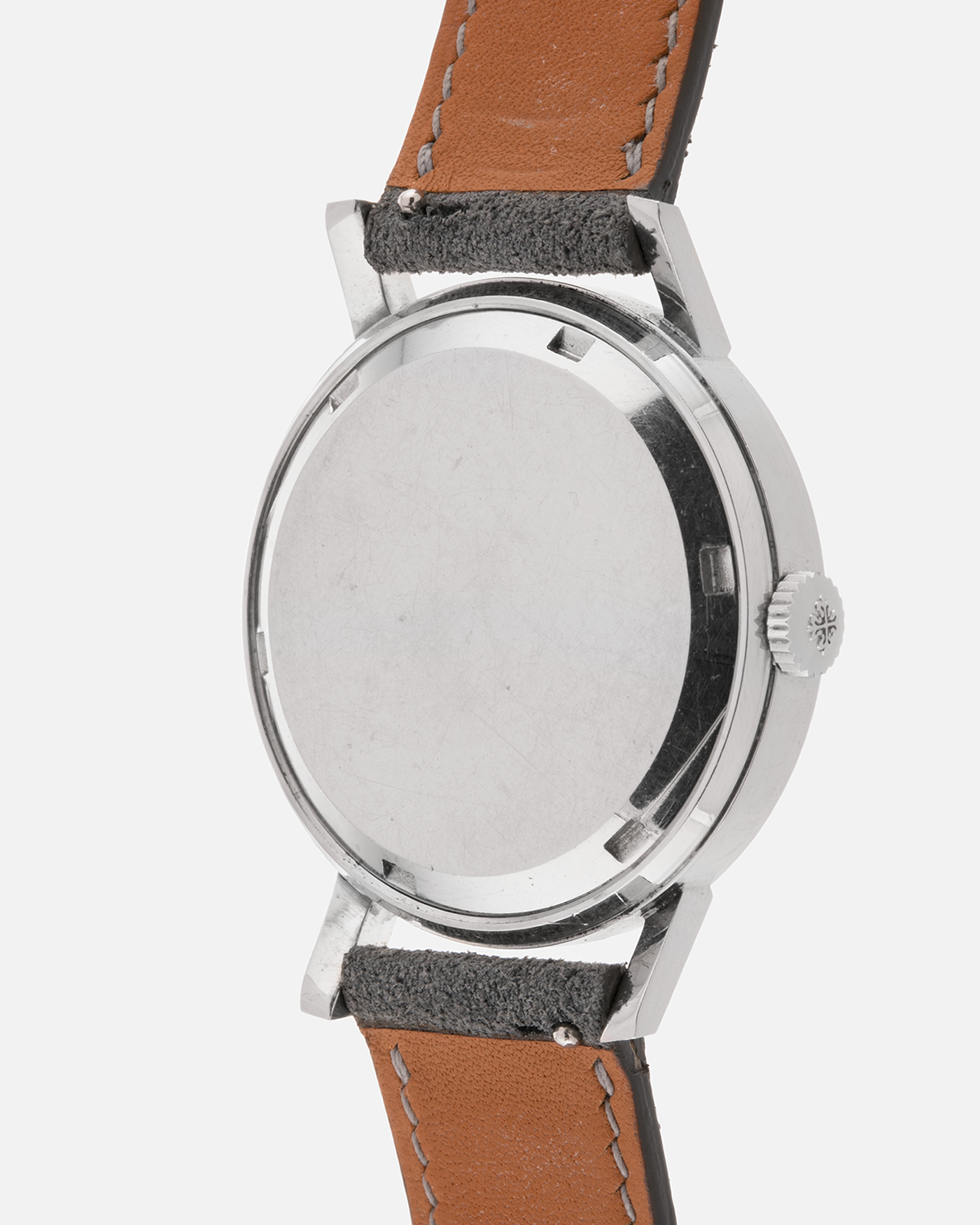 Brand: Patek Philippe
Year: 1966
Model: Calatrava, Gubelin Signed
Reference: 3417
Material: Stainless Steel
Movement: Patek Philippe Cal. 27-AM 400
Case Dimensions: 35mm Diameter 11mm Thickness
Lug Width: 18mm
Strap: Dream Rocketeers Grey Suede Strap with Generic Stainless Steel Buckle