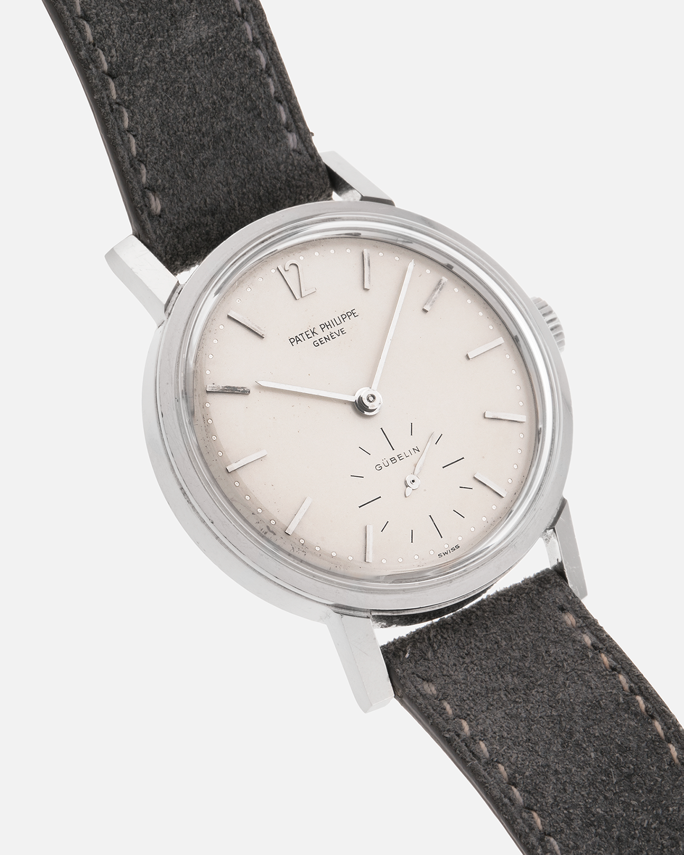 Brand: Patek Philippe
Year: 1966
Model: Calatrava, Gubelin Signed
Reference: 3417
Material: Stainless Steel
Movement: Patek Philippe Cal. 27-AM 400
Case Dimensions: 35mm Diameter 11mm Thickness
Lug Width: 18mm
Strap: Dream Rocketeers Grey Suede Strap with Generic Stainless Steel Buckle